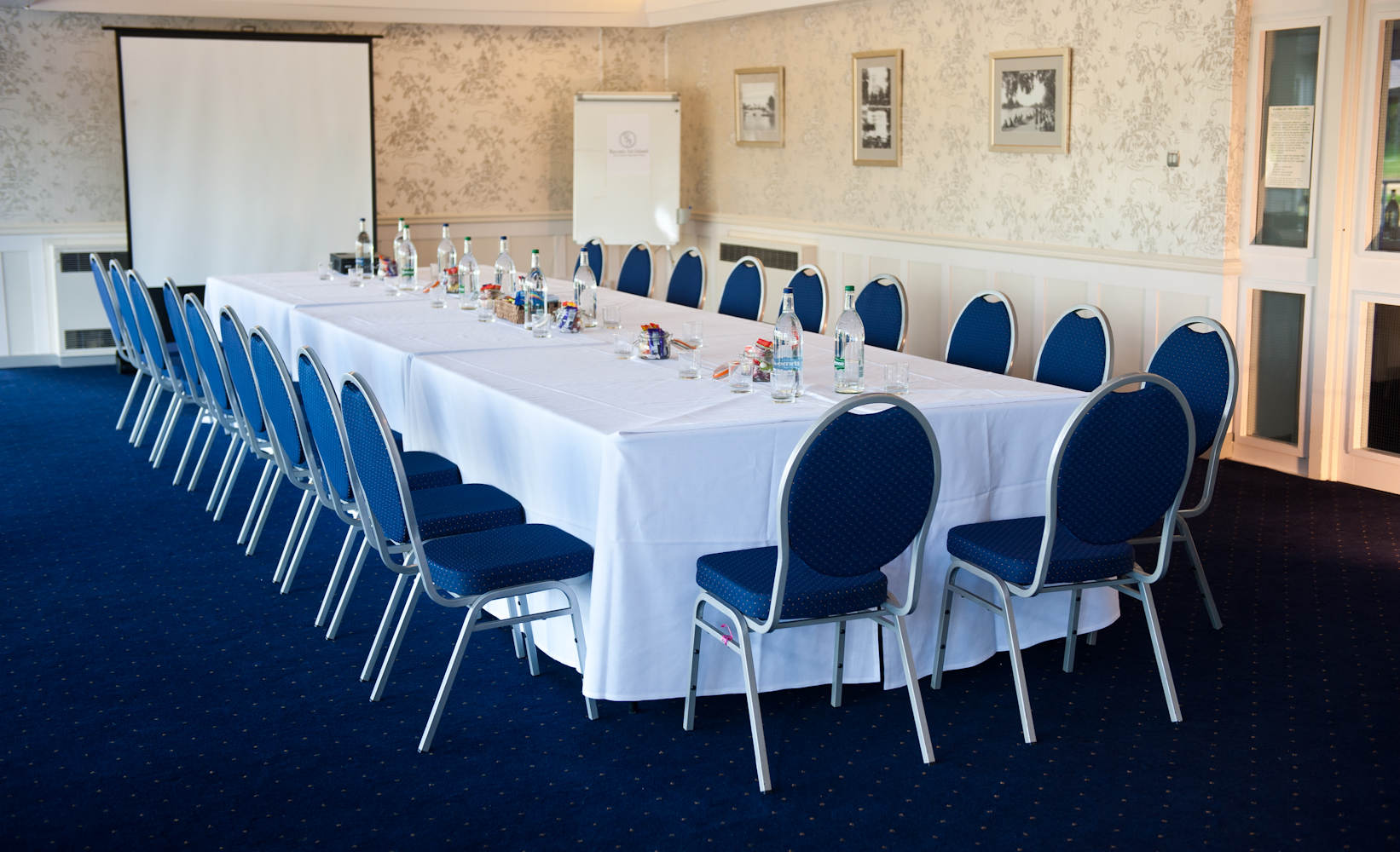 Thames Suite meeting room with blue chairs, ideal for conferences and workshops.