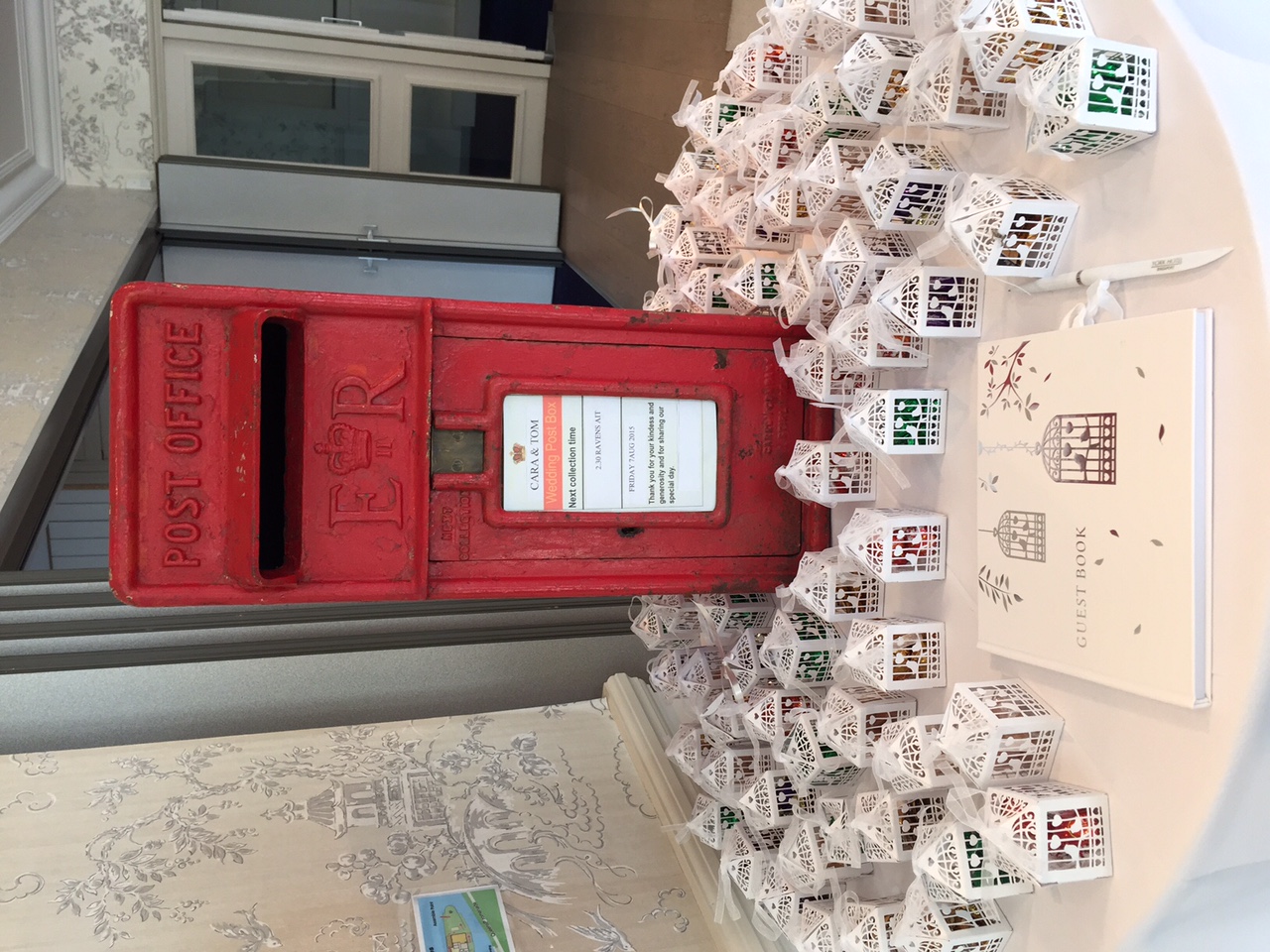 Thames Suite on Ravens Ait Island with red post box and white lanterns for events.
