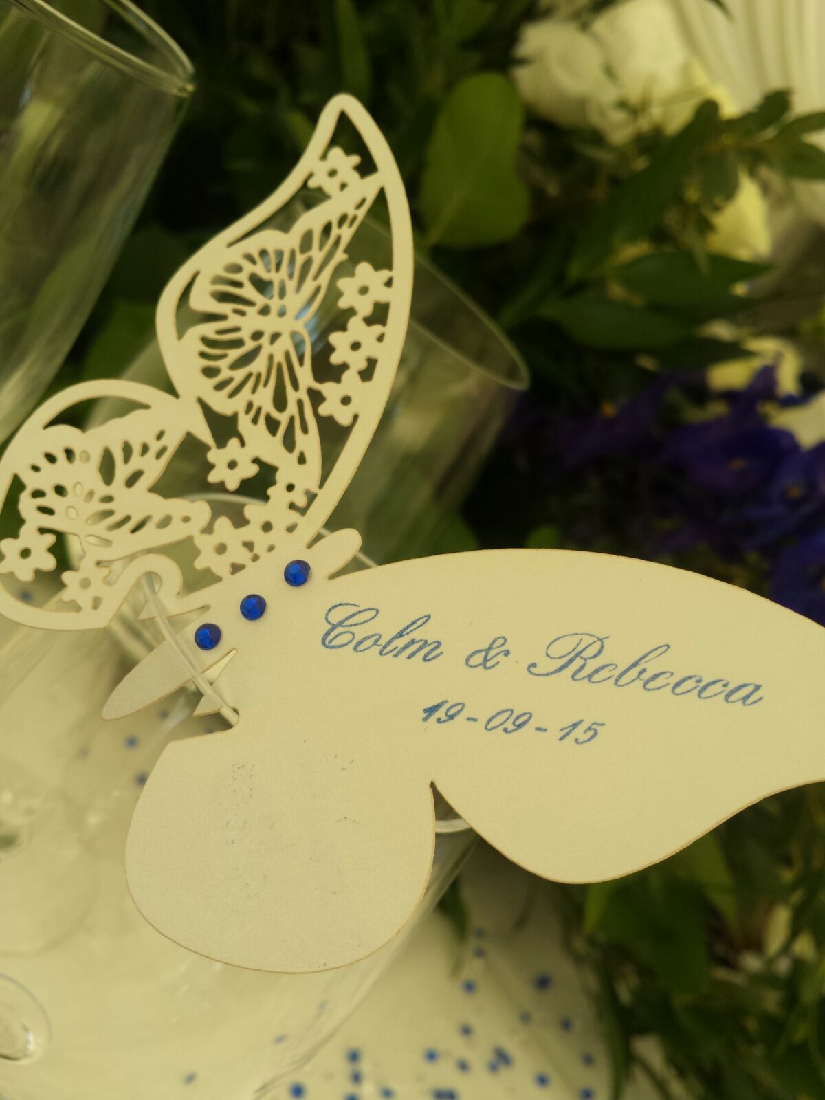 Elegant wedding table setting with butterfly place card for Colm & Rebecca on Ravens Ait Island.