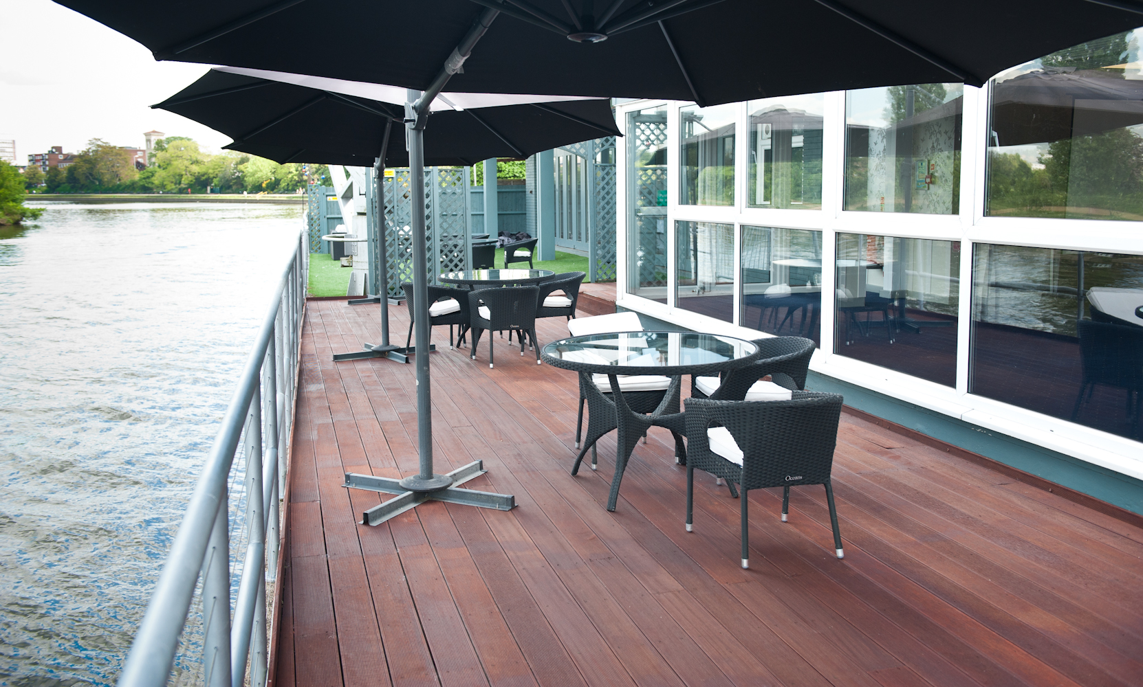 Thames Suite outdoor event space with stylish furniture, ideal for networking by the river.