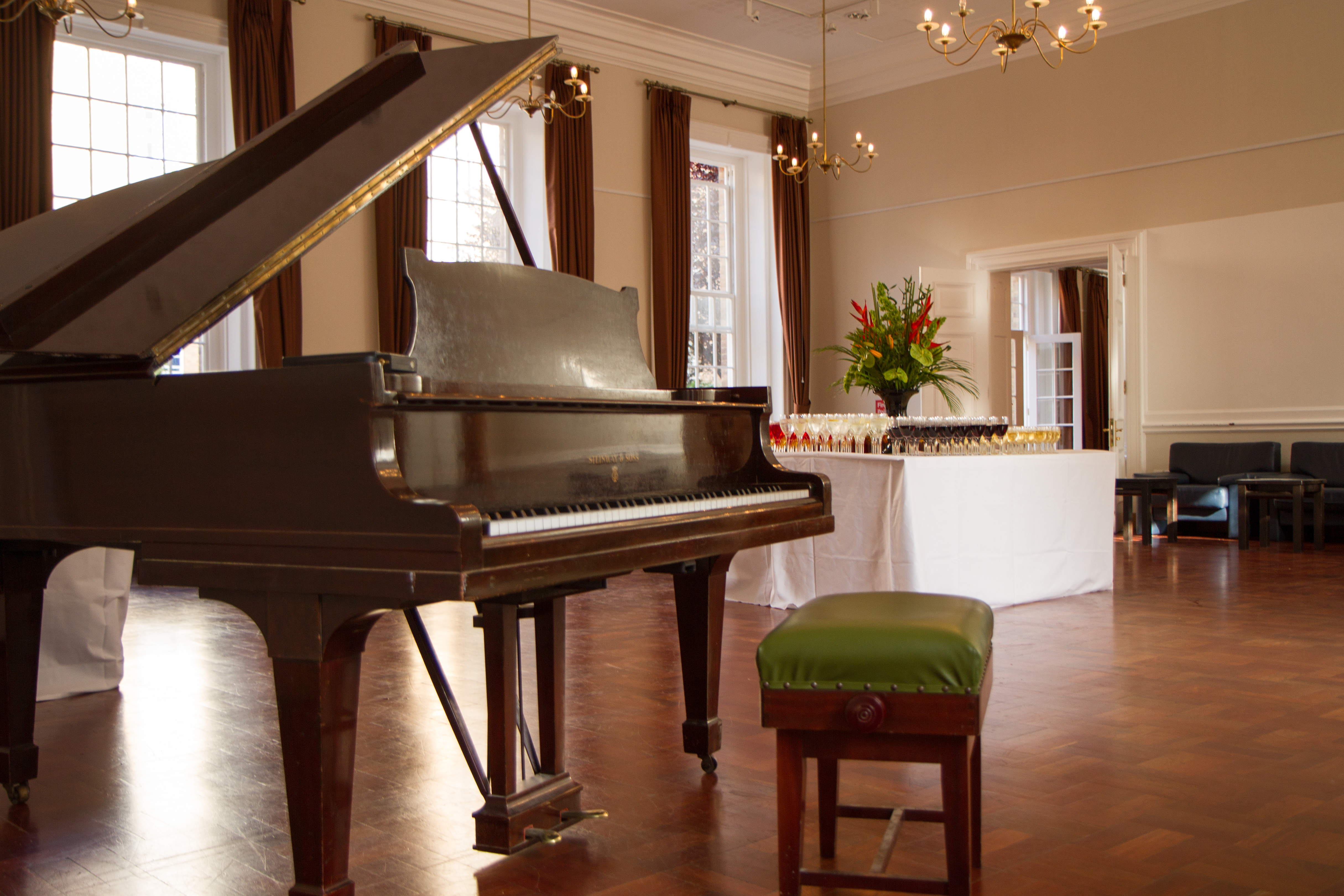 Elegant event space in Goodenough House with grand piano for receptions and concerts.