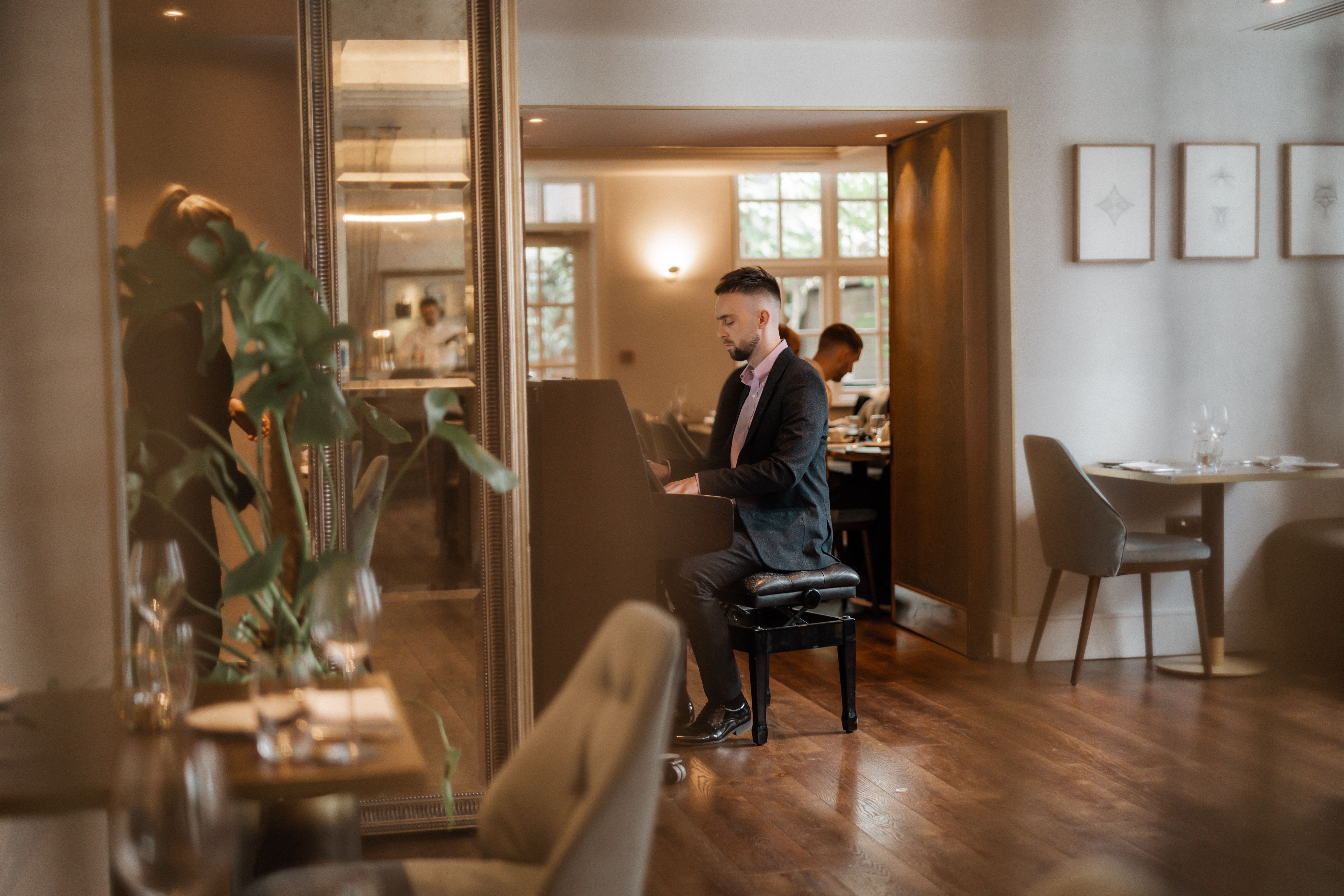 Elegant dining in The Roseate's Reading Room with live piano for upscale events.