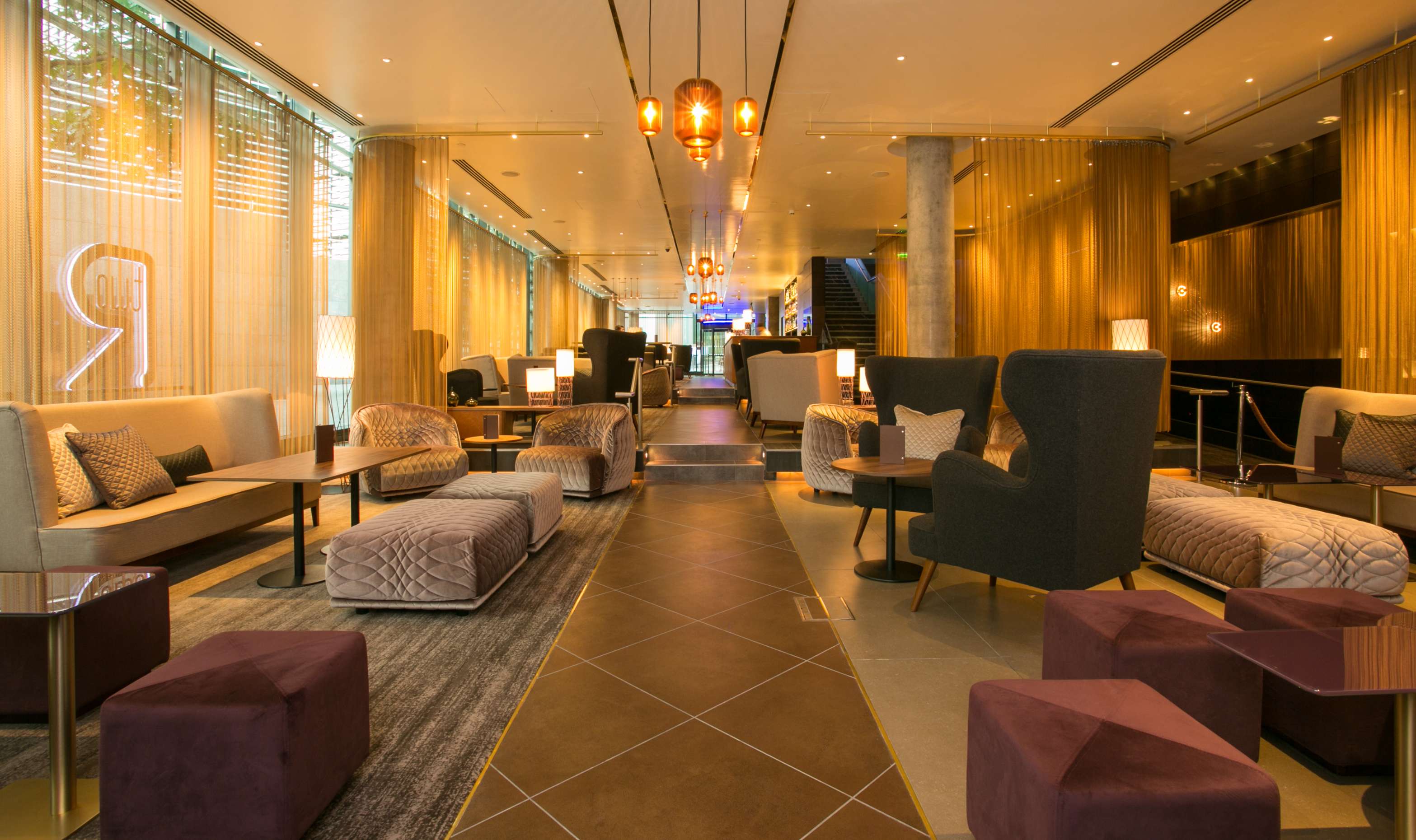 Stylish lounge at TwoRuba Bar, Hilton London Tower Bridge, ideal for networking events.