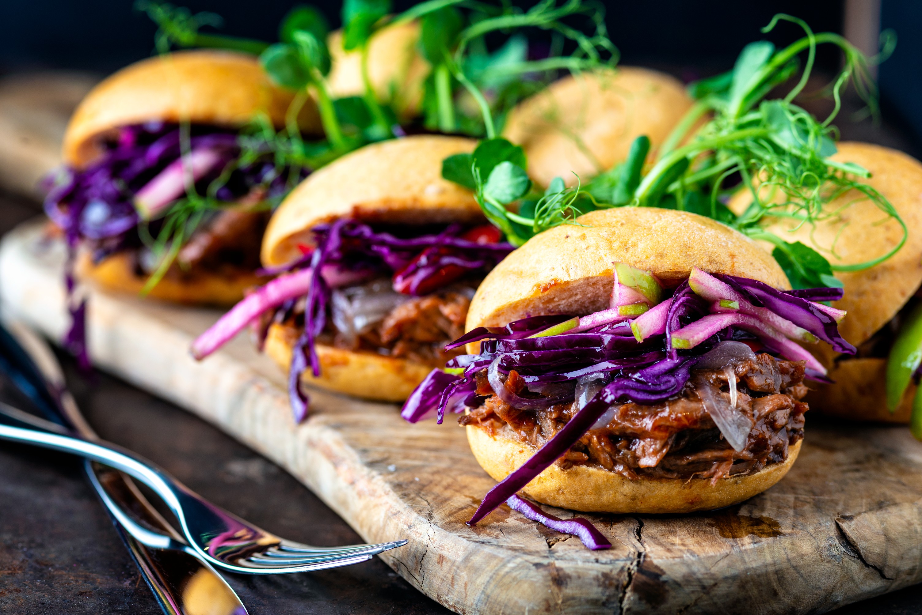 Gourmet sliders with pulled meat and purple cabbage at TwoRuba Bar, London event catering.
