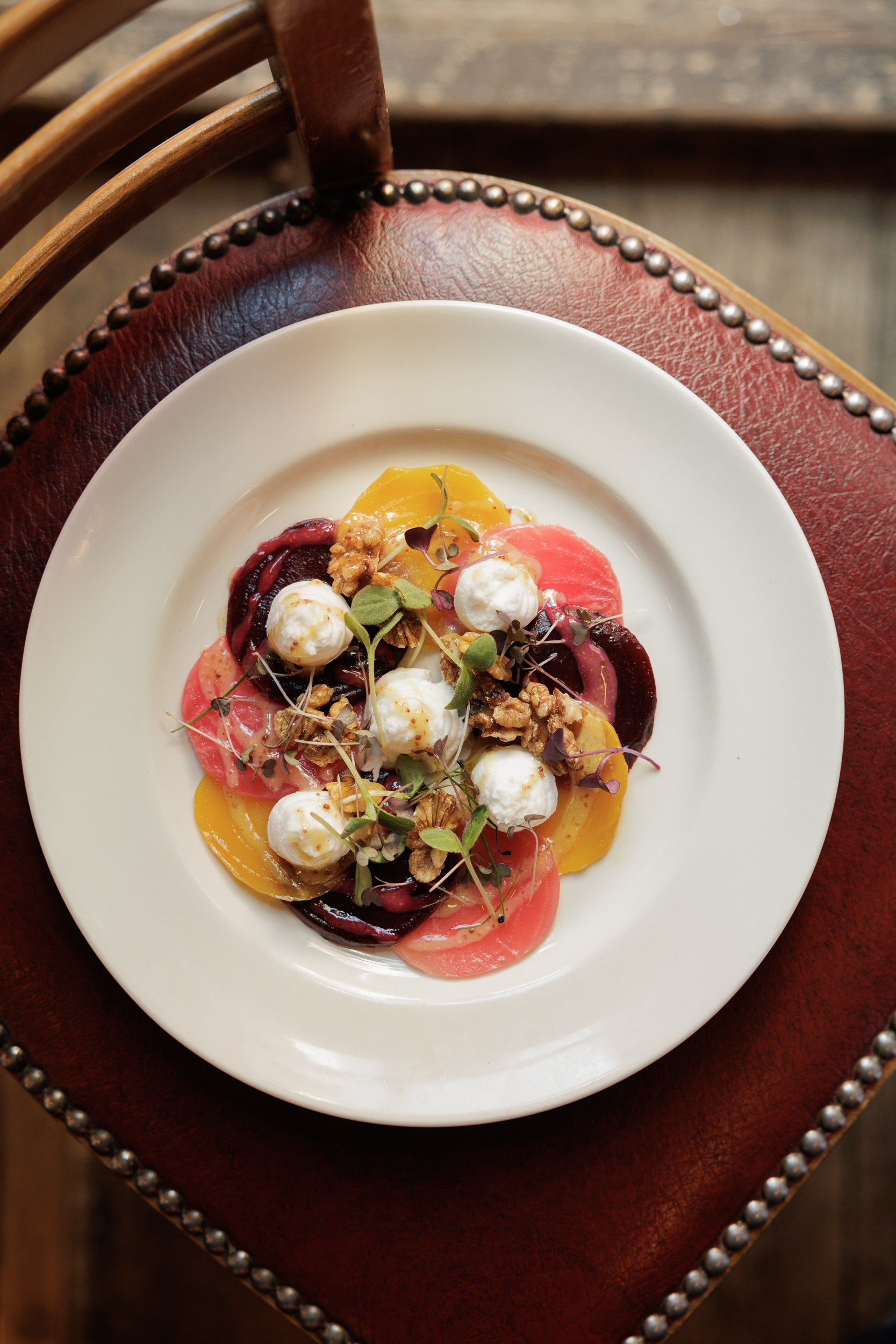 Vibrant beet salad with burrata in Bleeding Heart wine cellar for events catering.