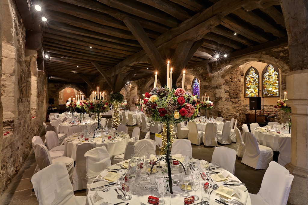 Elegant banquet hall with floral centerpieces, perfect for weddings and corporate events.