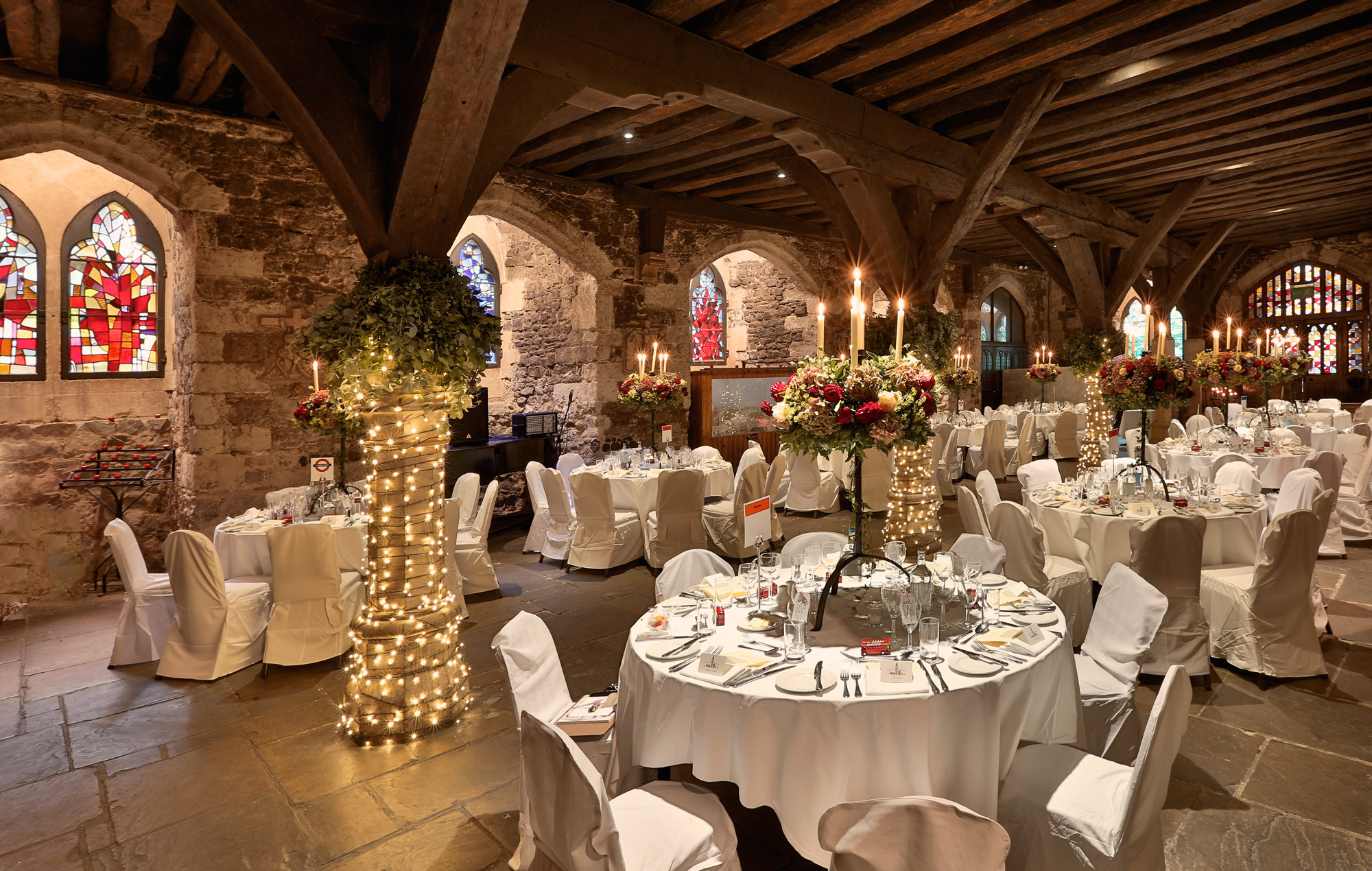 Elegant banquet hall in The Crypt with rustic stone walls, ideal for weddings and events.