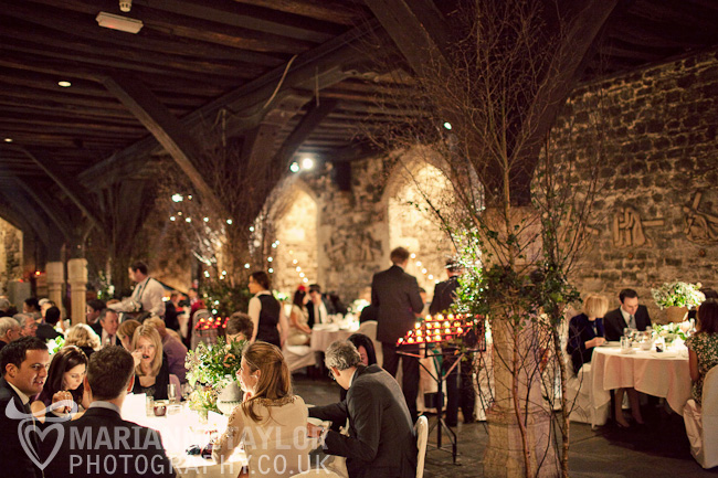 Elegant event space in The Crypt with floral centerpieces, perfect for weddings and dinners.