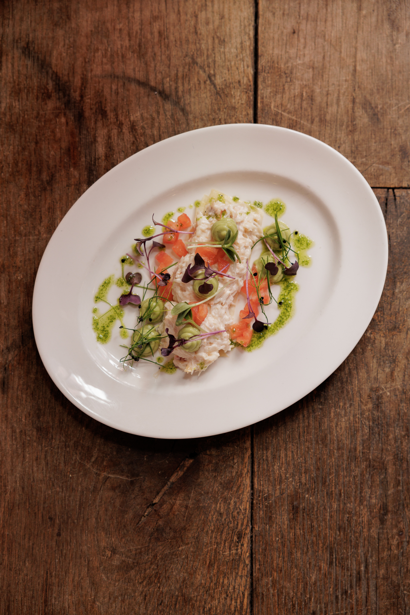 Elegant plated dish in The Crypt, showcasing vibrant colors for upscale dining events.