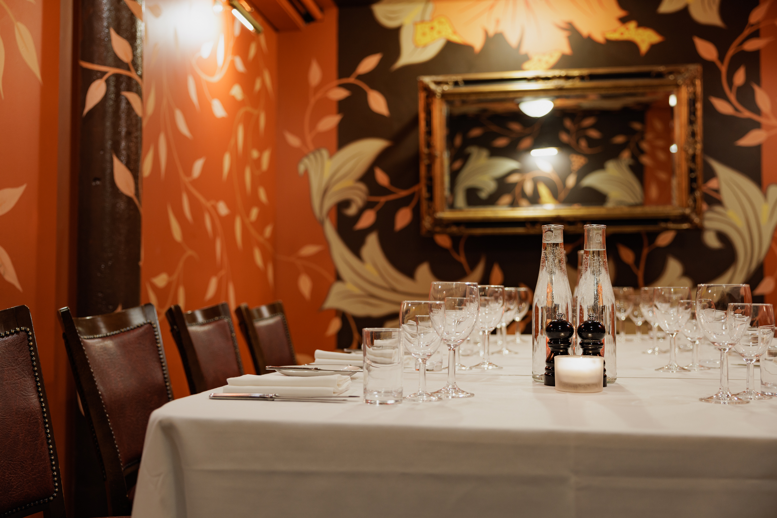 Elegant dining table in Bleeding Heart, perfect for intimate gatherings and corporate dinners.