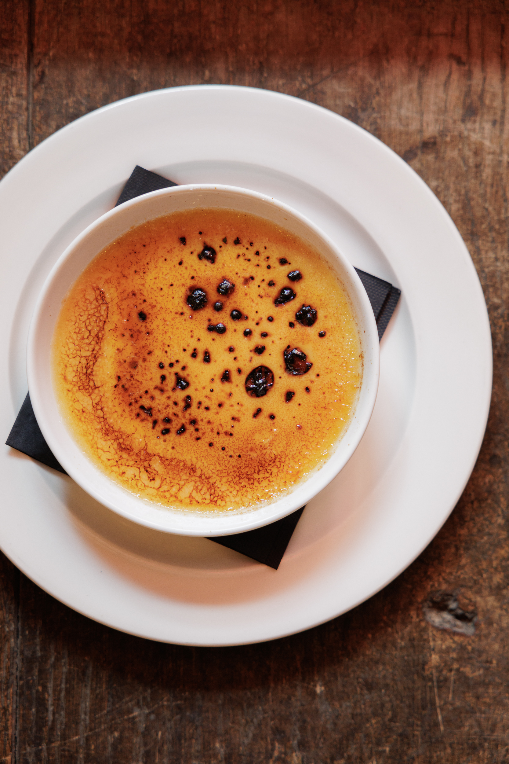Elegant crème brûlée with golden caramelized top for upscale events and gatherings.