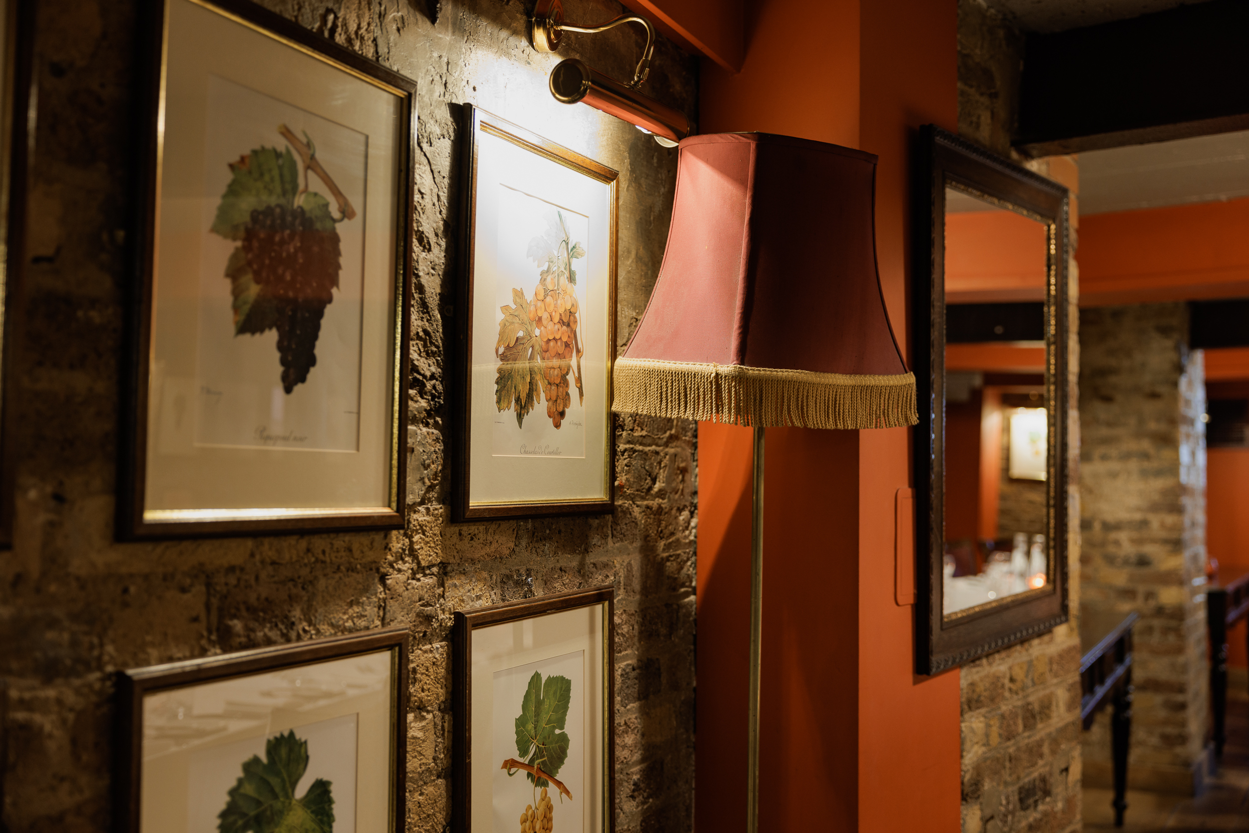 Cozy wine cellar venue with rustic brick walls for intimate events and meetings.