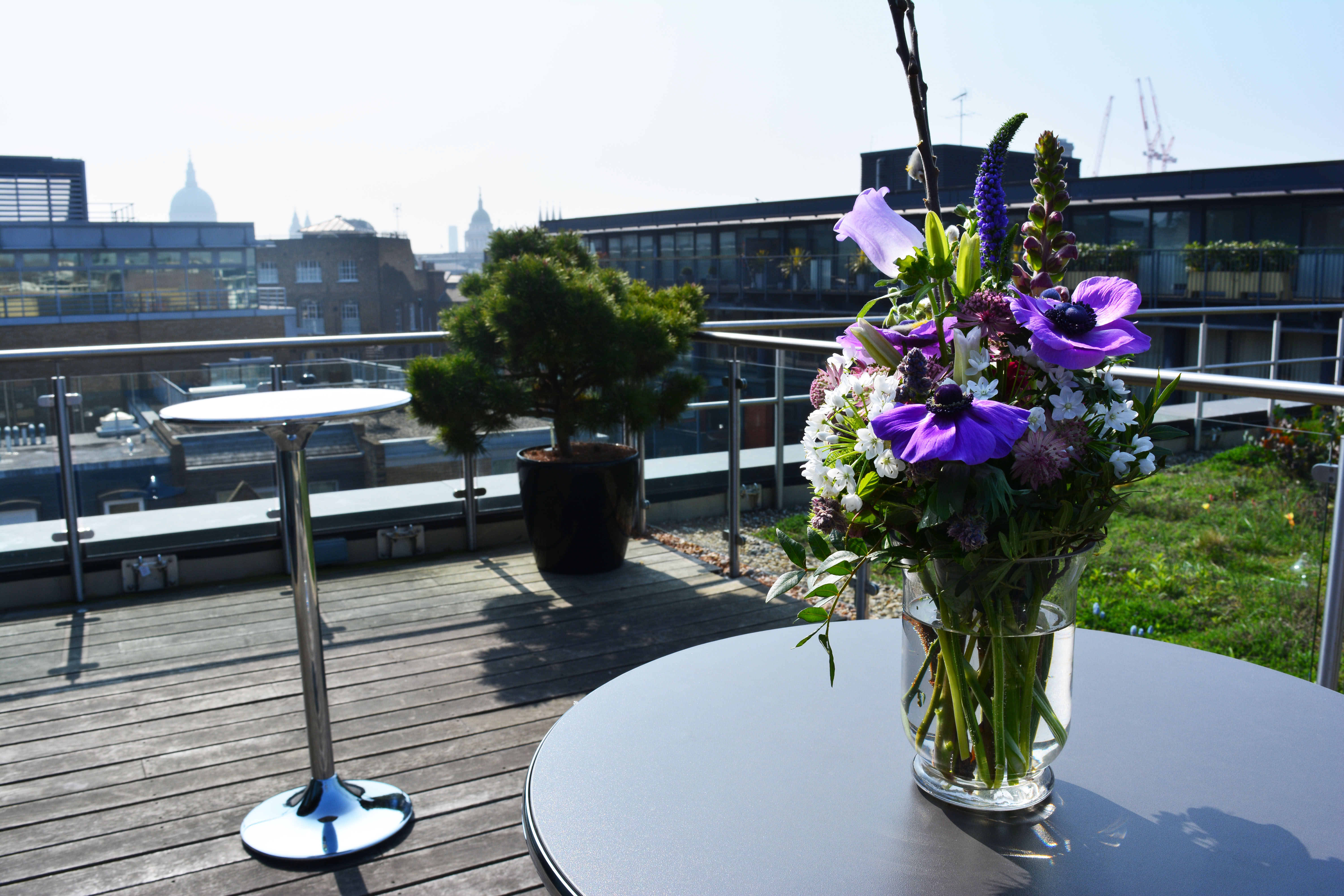 Agas Harding Conference Room with floral centerpiece, perfect for networking events and receptions.
