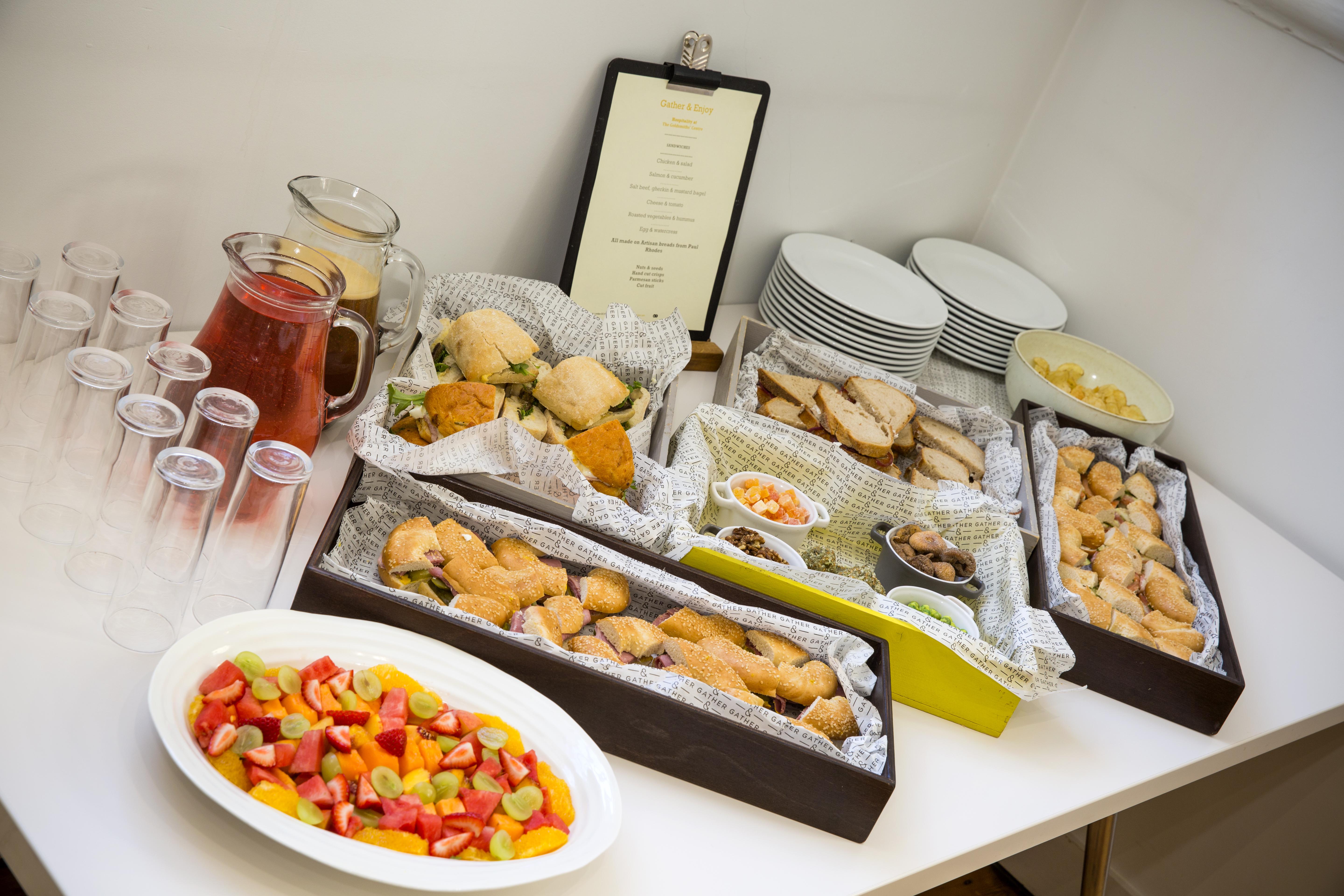 Catering setup with pastries and sandwiches for networking events at The Goldsmiths' Centre.