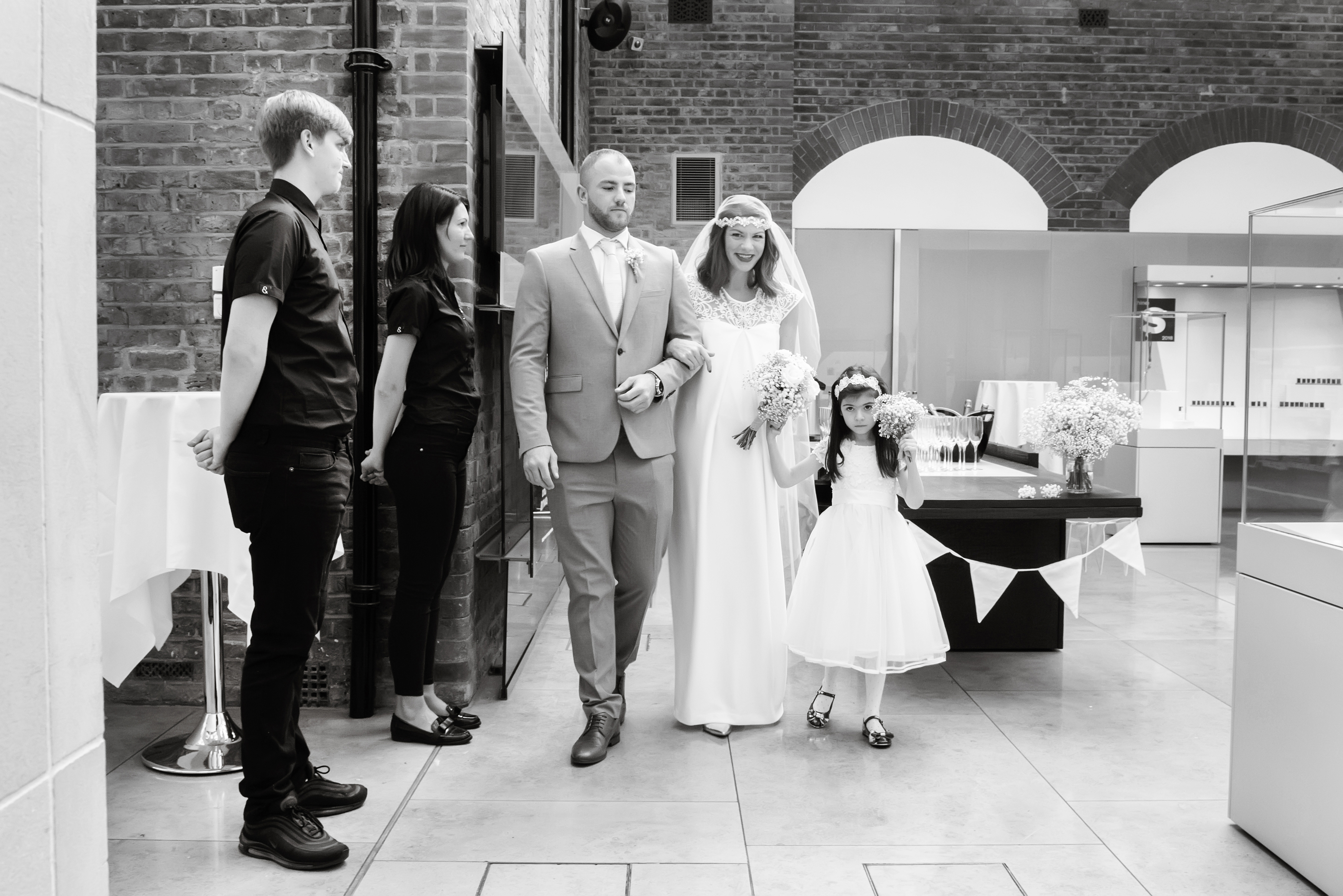 Wedding ceremony in The Goldsmiths' Centre Atrium, elegant decor and attentive staff.