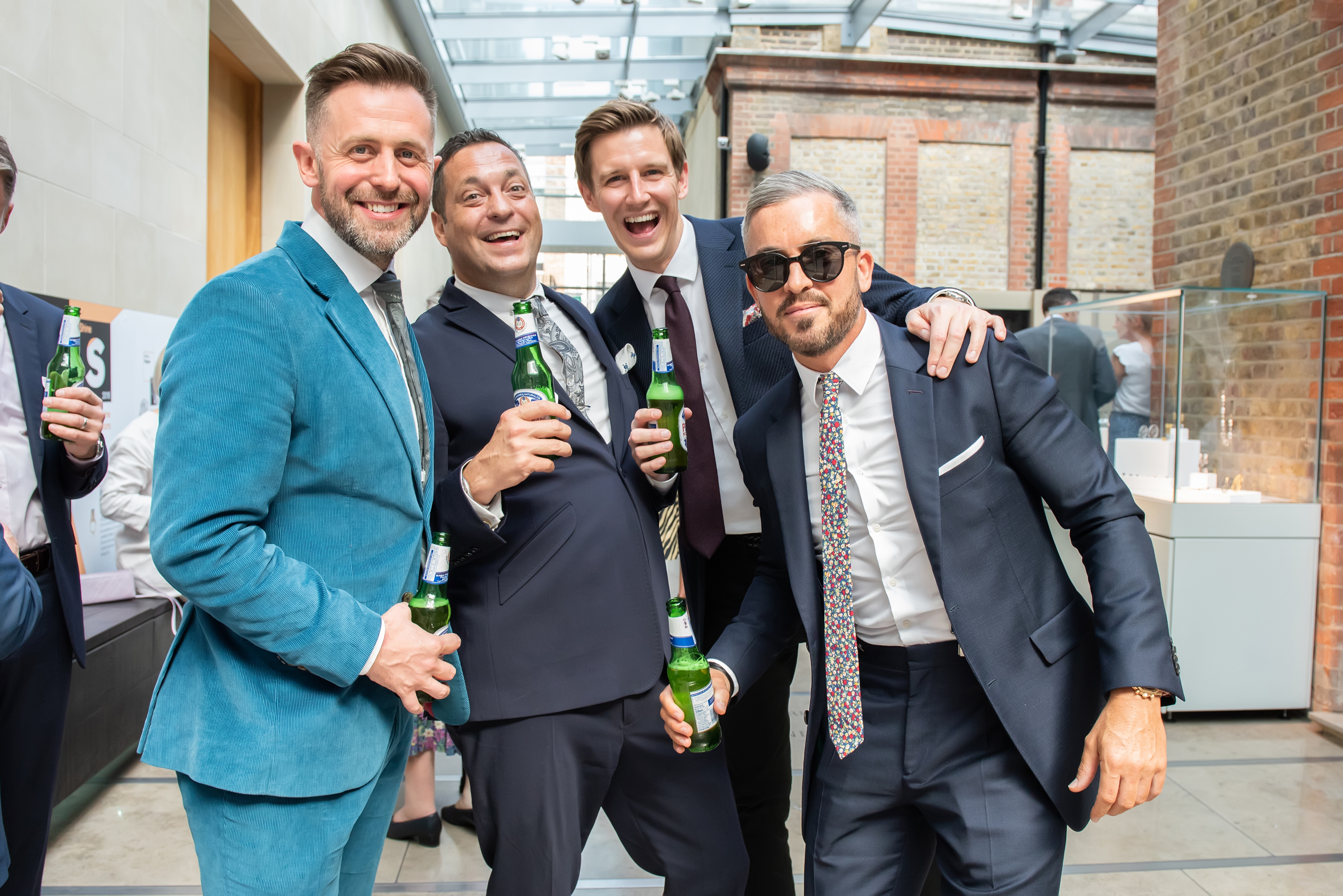 Lively networking event in The Goldsmiths' Centre Atrium, showcasing stylish attire and connections.