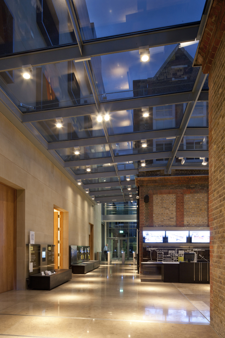 Modern event space with glass roof, ideal for networking and receptions at Goldsmiths' Centre.