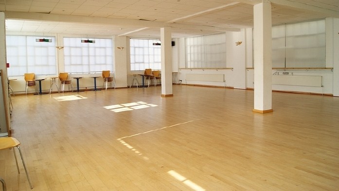 Spacious STUDIO 1 with wooden flooring for workshops and events at The Factory Fitness.