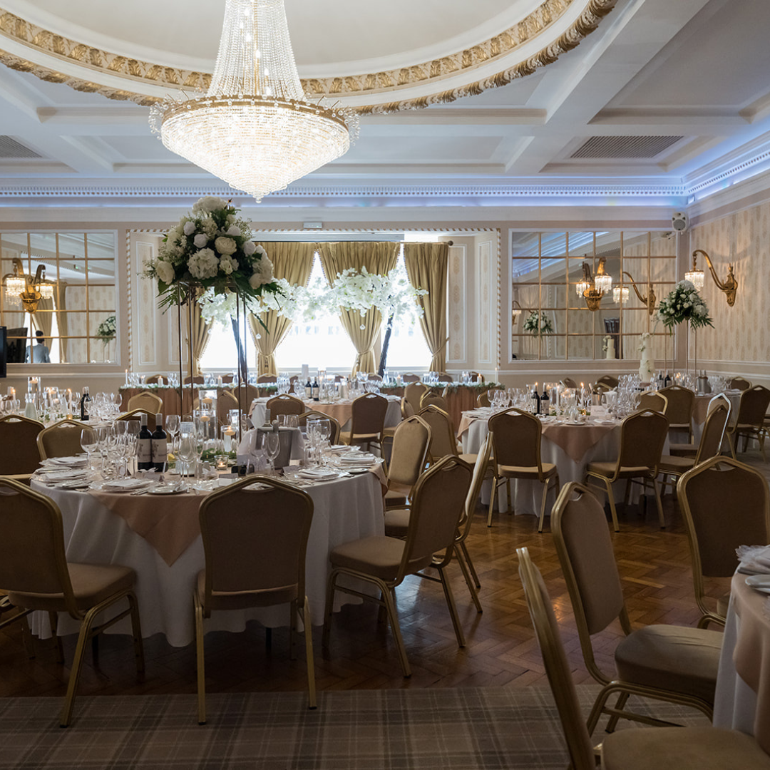 Elegant banquet hall with fine china, perfect for weddings and corporate events.