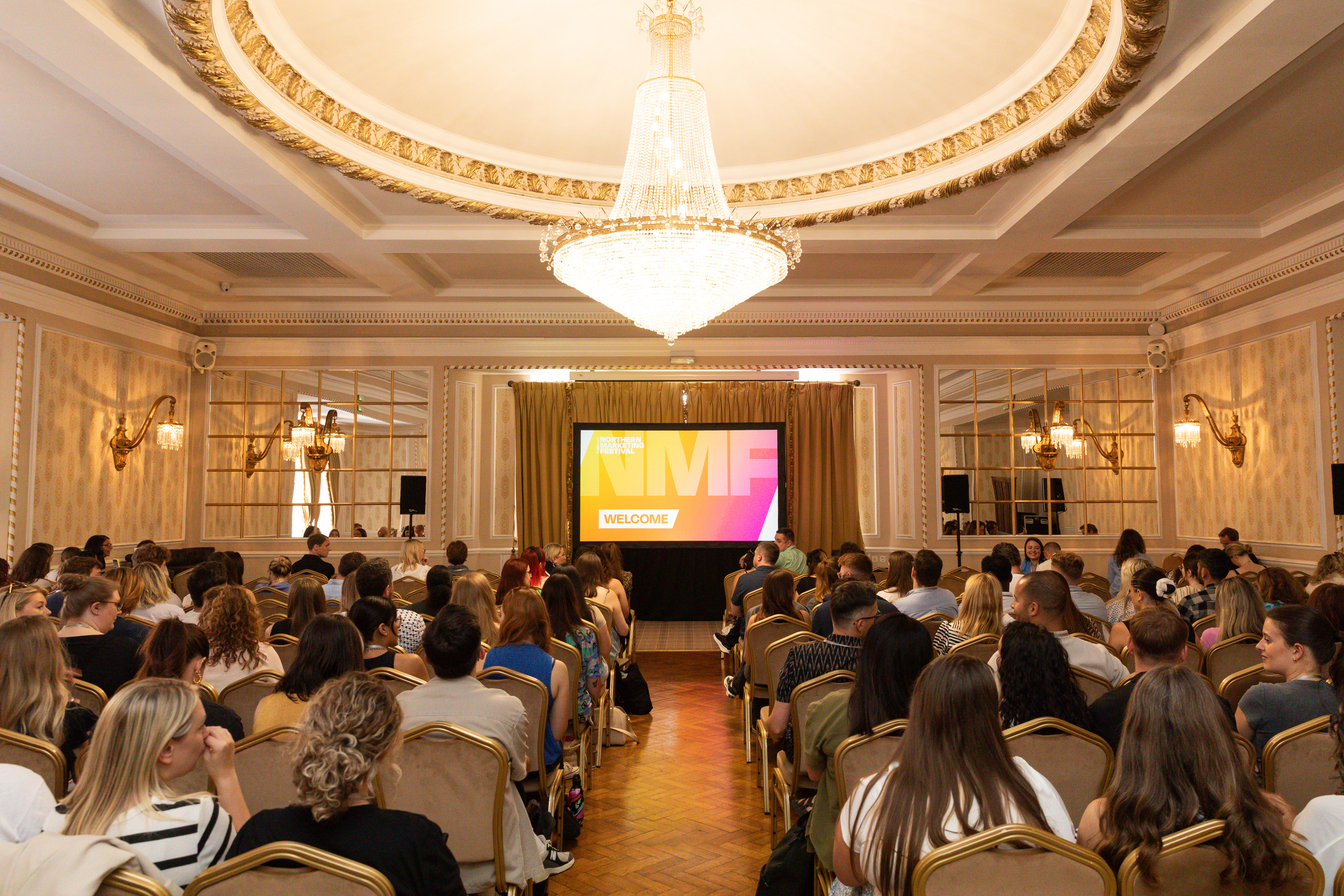 Goulburn Suite conference in Manchester Hall with elegant decor and vibrant branding.