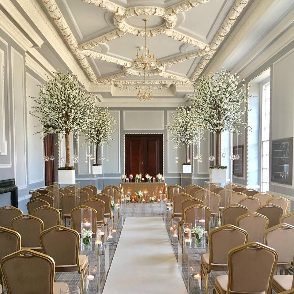 Elegant wedding ceremony space at The Museum in Manchester Hall with floral arrangements.