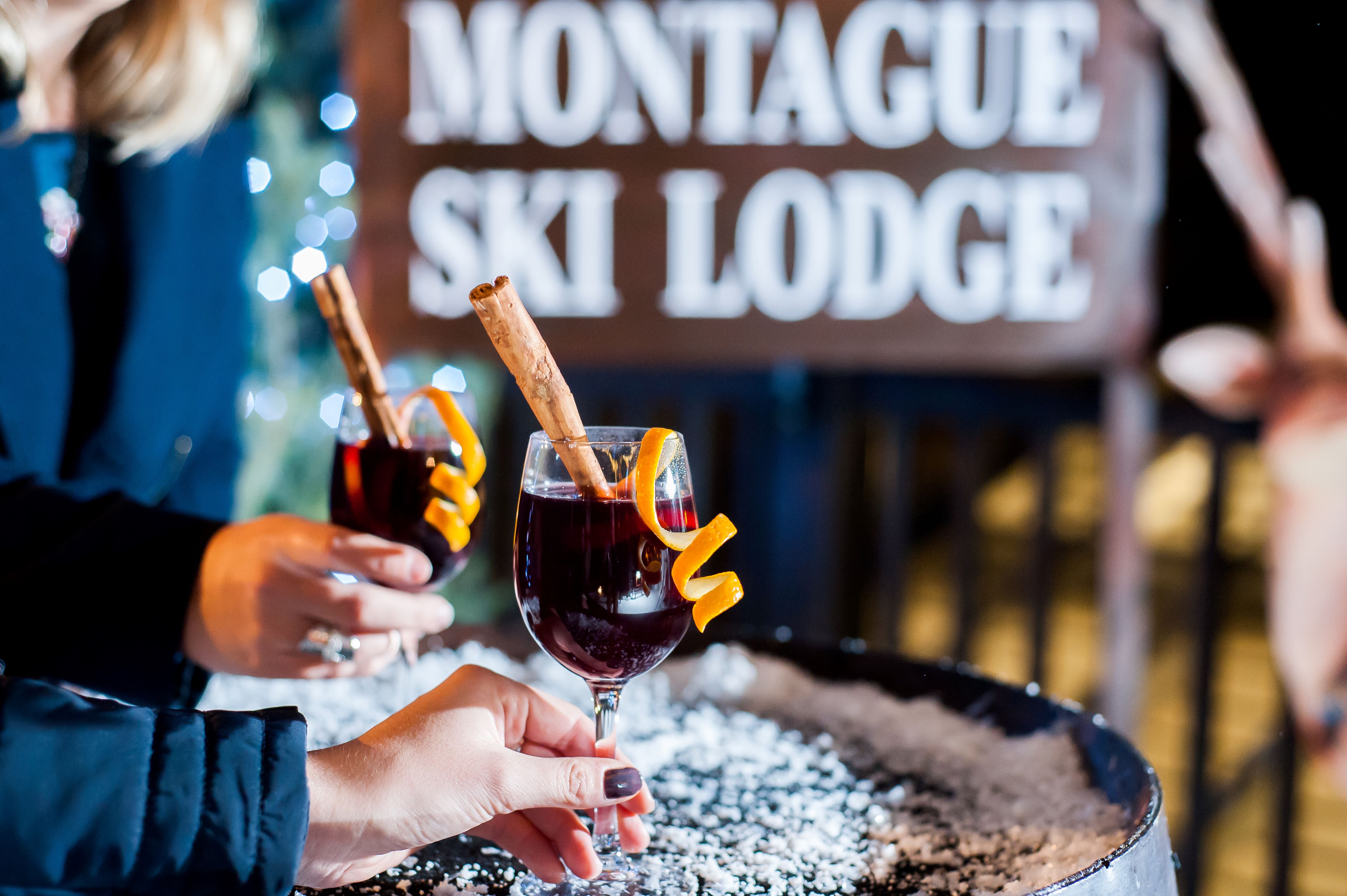Cozy winter event at Montague Ski Lodge with elegant drinks for holiday parties.