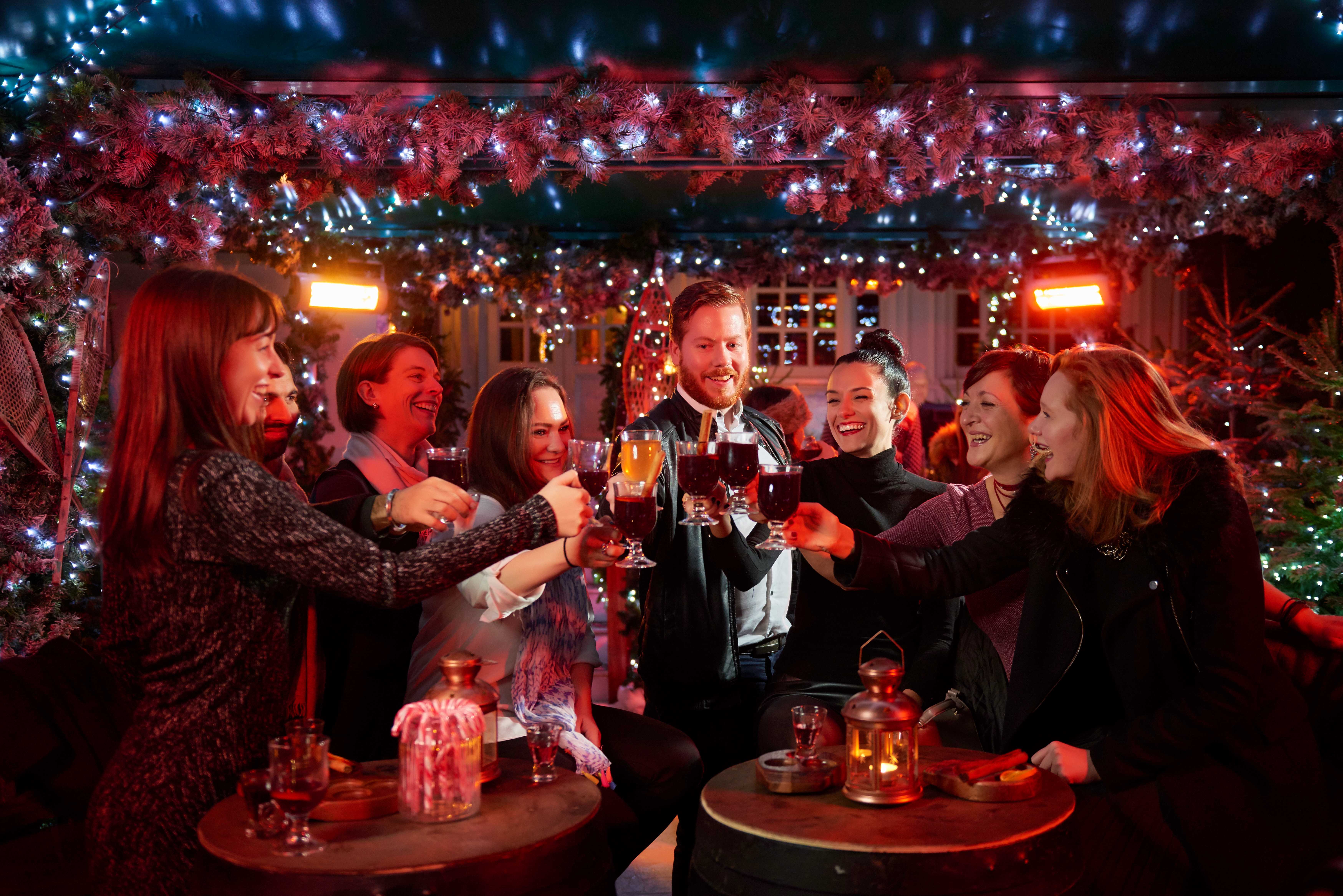 Festive gathering at The Ski Lodge, twinkling lights, perfect for holiday parties.