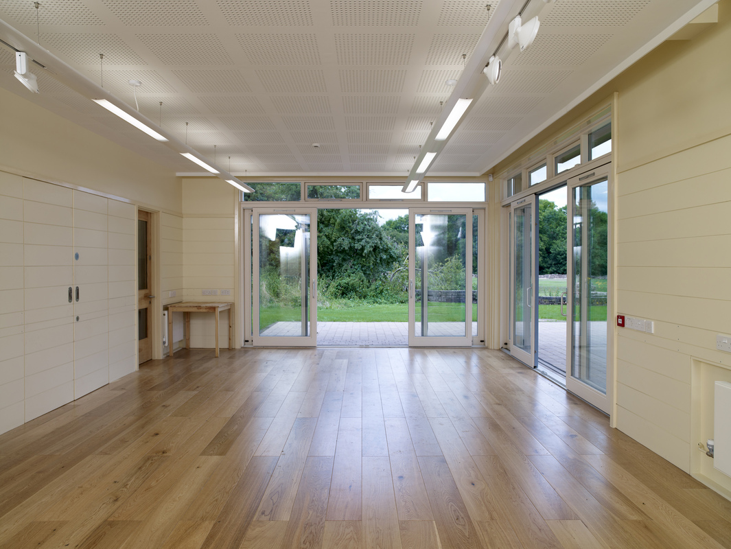 Versatile event space in Weoley Castle with natural light, ideal for workshops and gatherings.