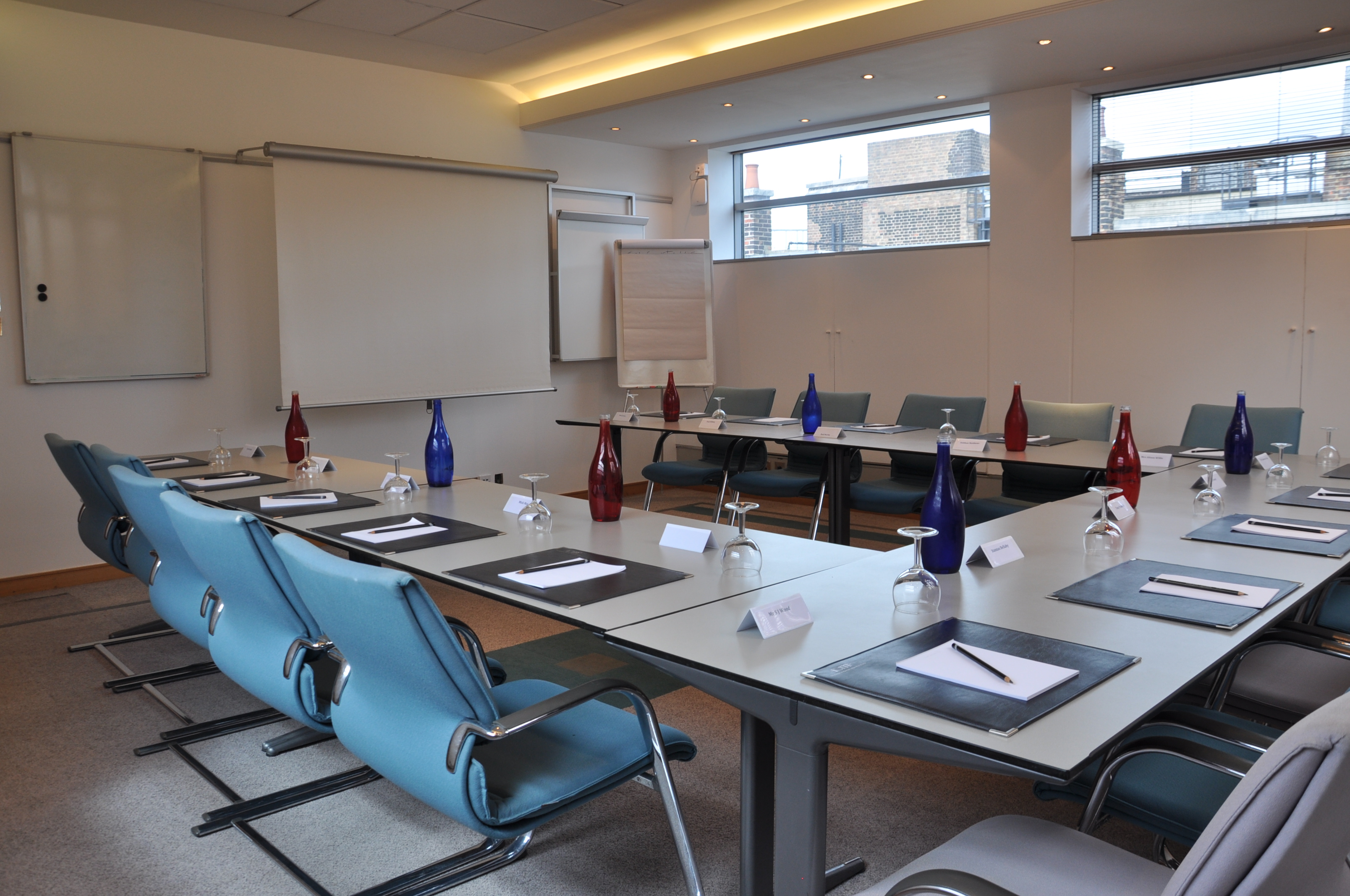5th Floor Chromium Boardroom 1 with elegant table setup for professional meetings.