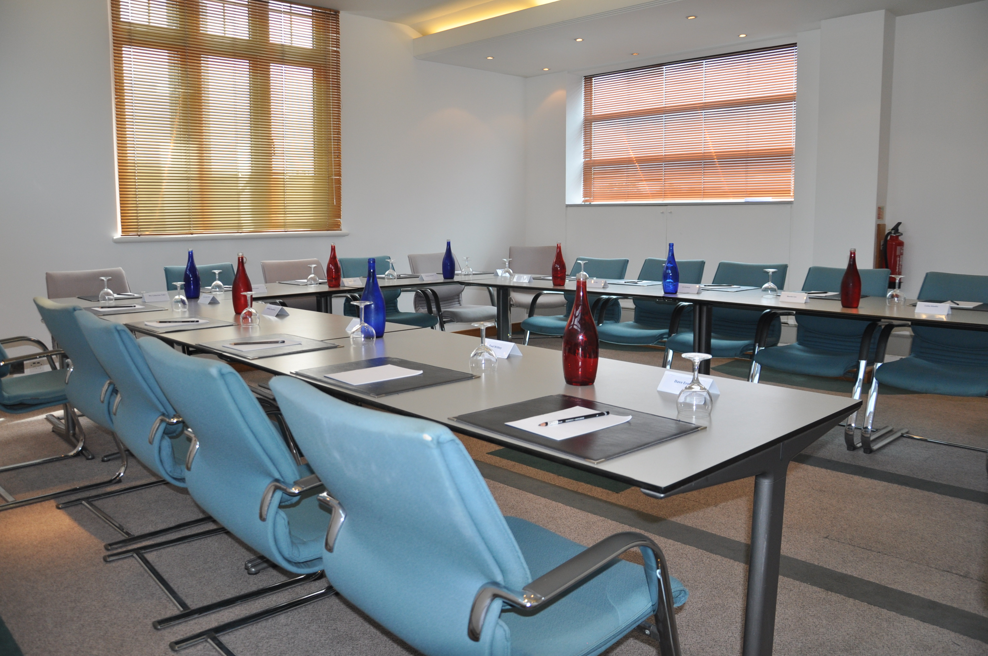 5th Floor Chromium Boardroom 1 with modern table, ideal for corporate meetings and workshops.