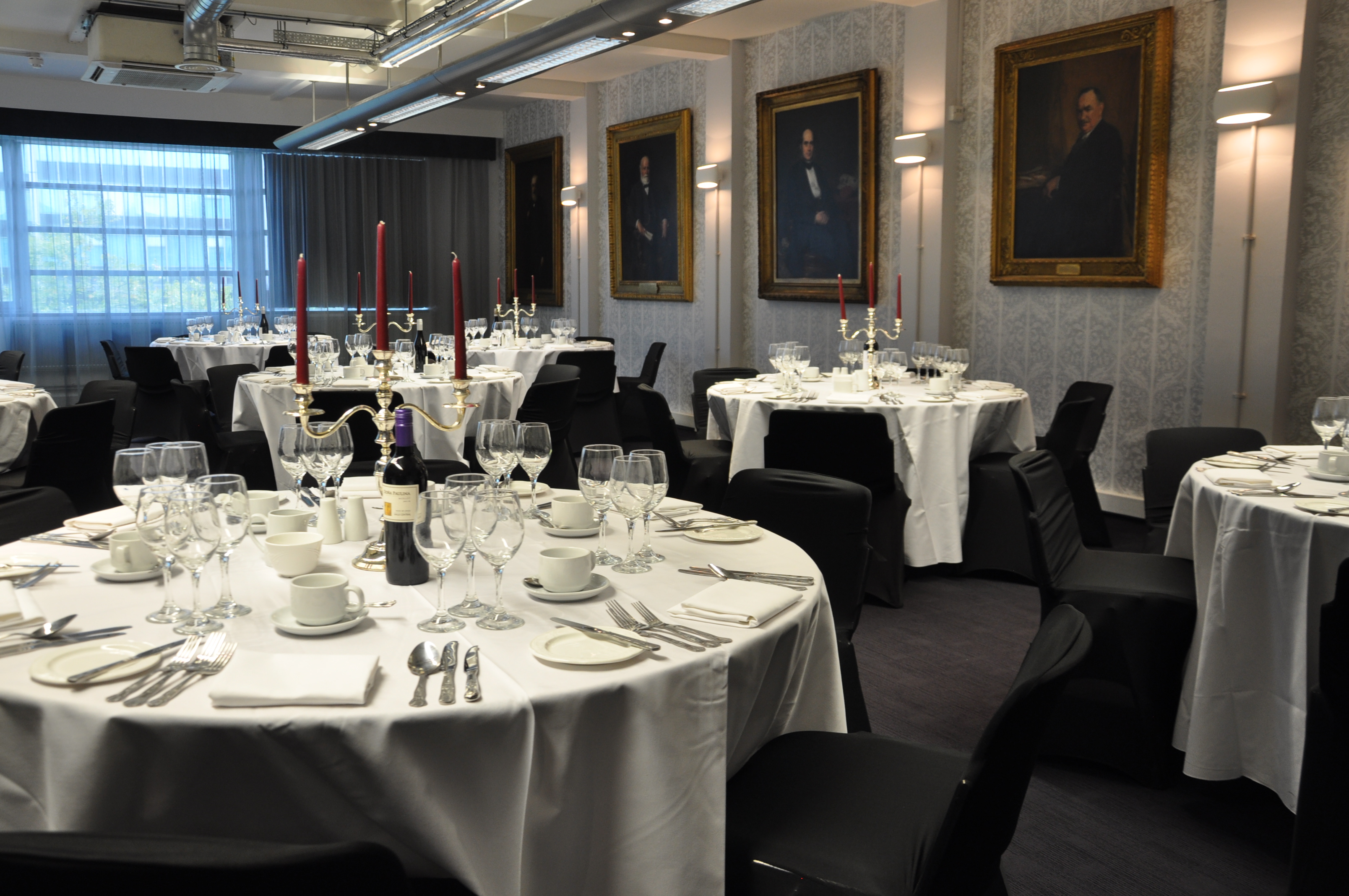 Elegant Bessemer Suite dining room with candelabras for corporate events and formal dinners.