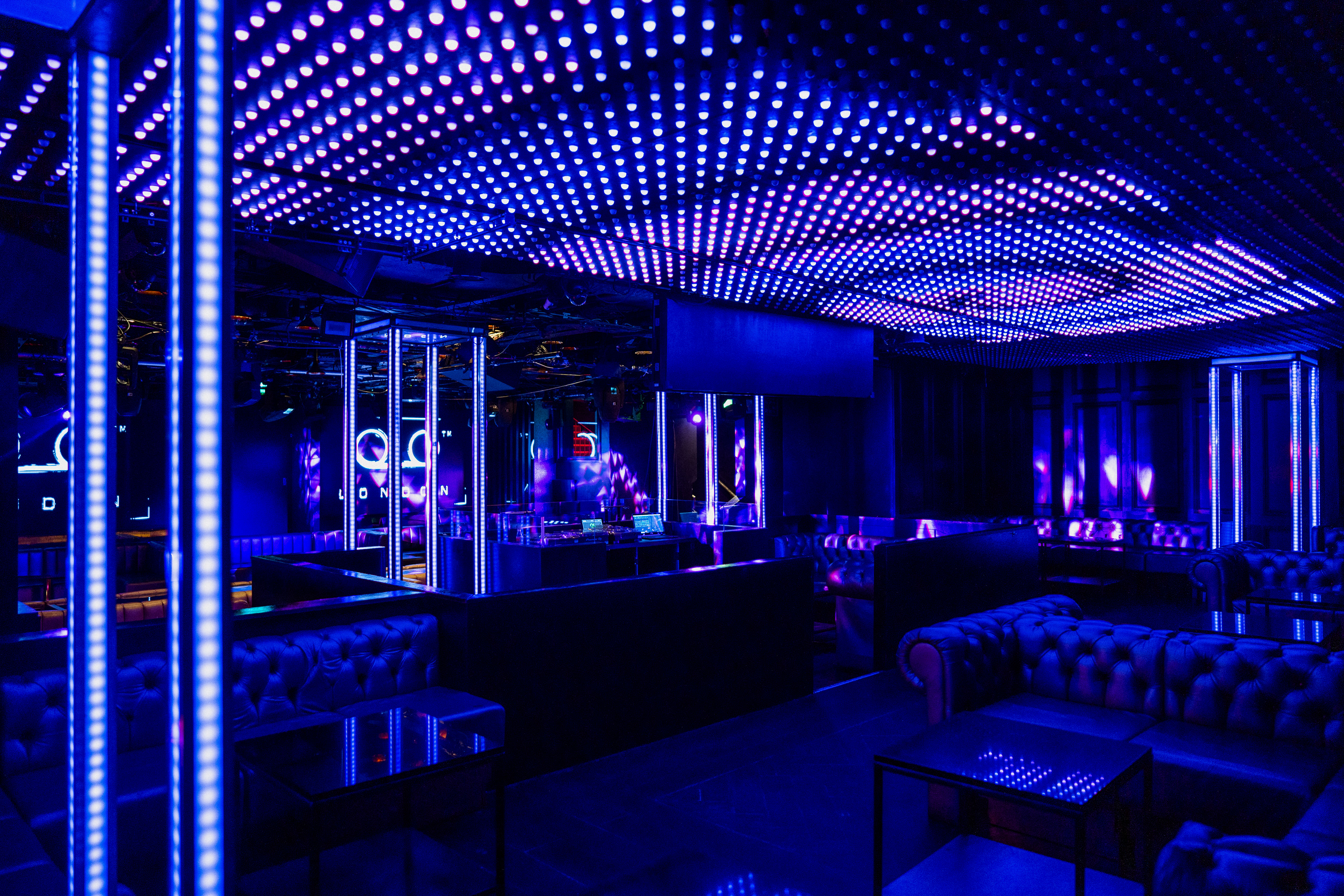 Modern event space in Tape London with vibrant blue and purple lighting for nightlife events.