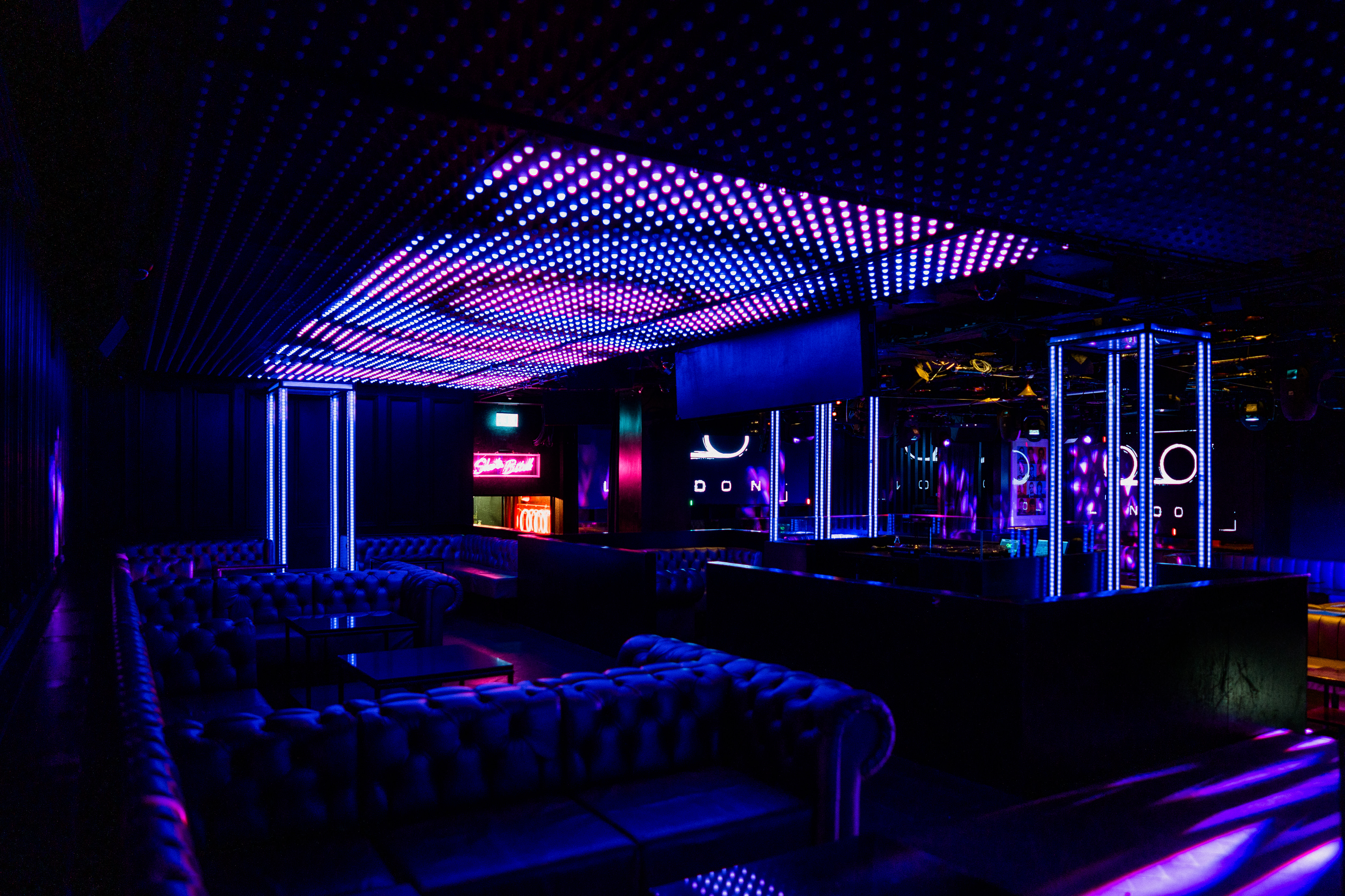 Modern event space in Tape London with vibrant lighting, ideal for networking and parties.