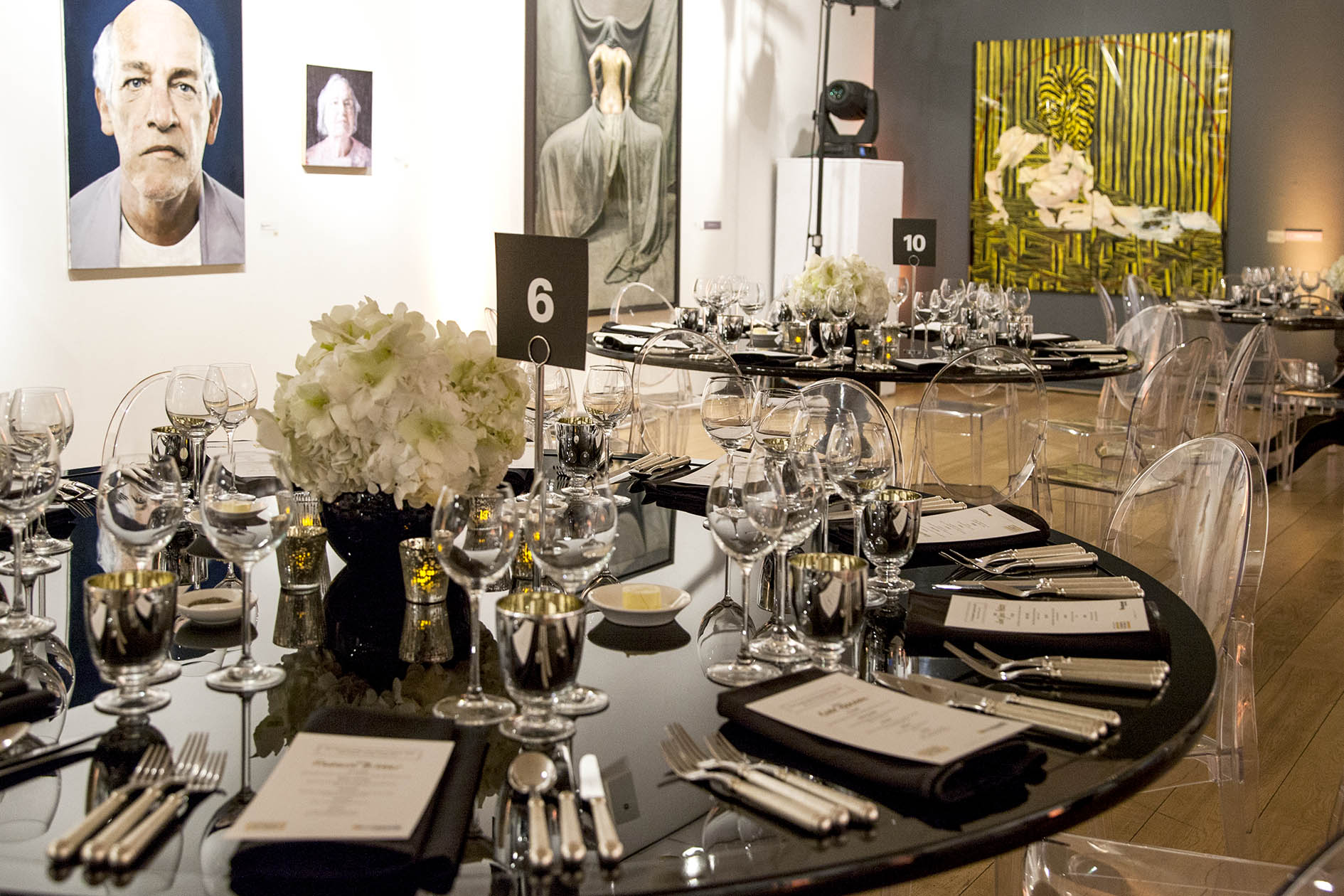 Sophisticated event setup with black tablecloths at Mall Galleries for corporate gatherings.