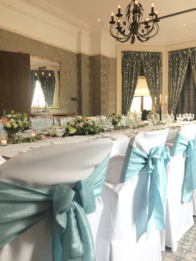 Elegant banquet table with floral centerpieces at The Petersham Hotel for upscale events.