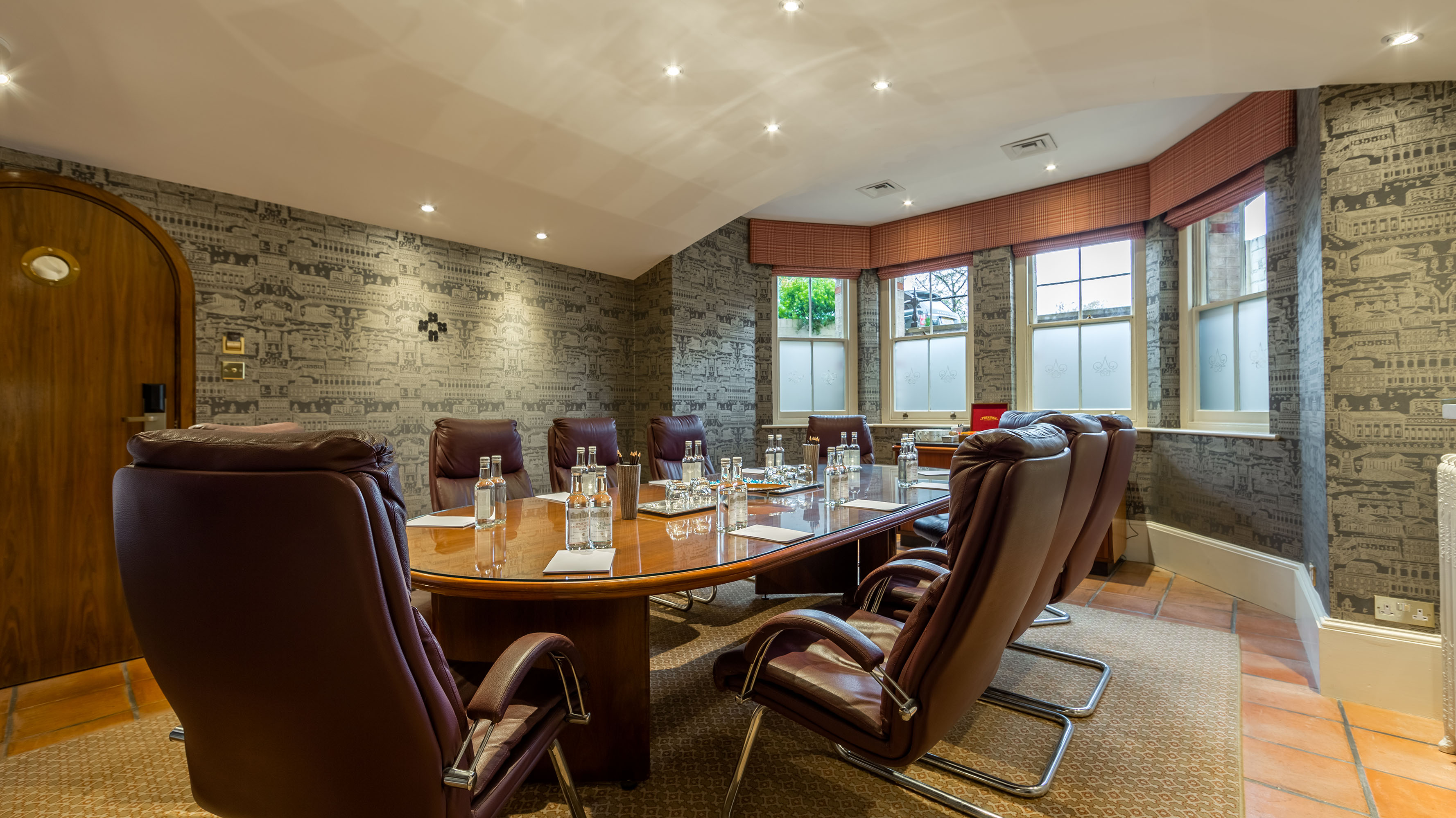 Large Study at Petersham Hotel with oval table, ideal for meetings and presentations.