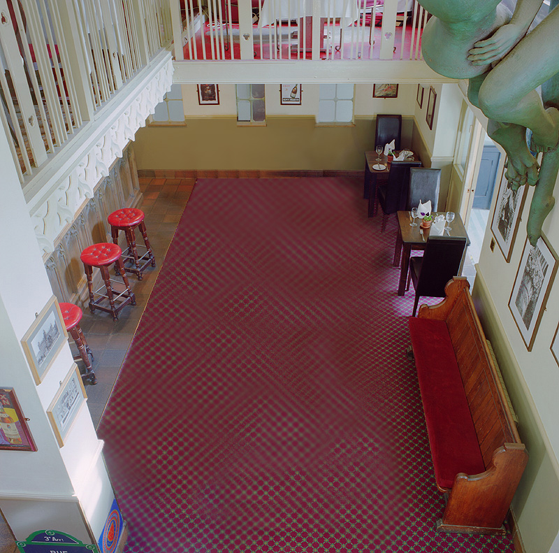 Gothic Bar & Restaurant with checkered carpet, perfect for corporate meetings and social events.