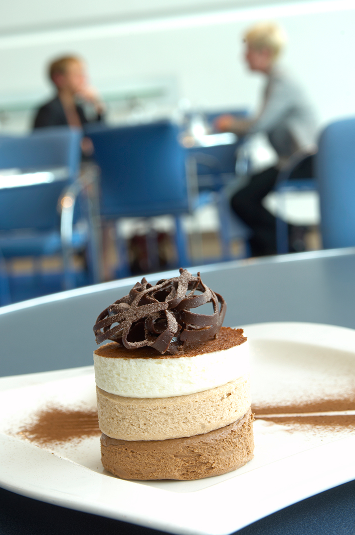 Professionals discussing event details in Barbirolli Room, Bridgewater Hall.