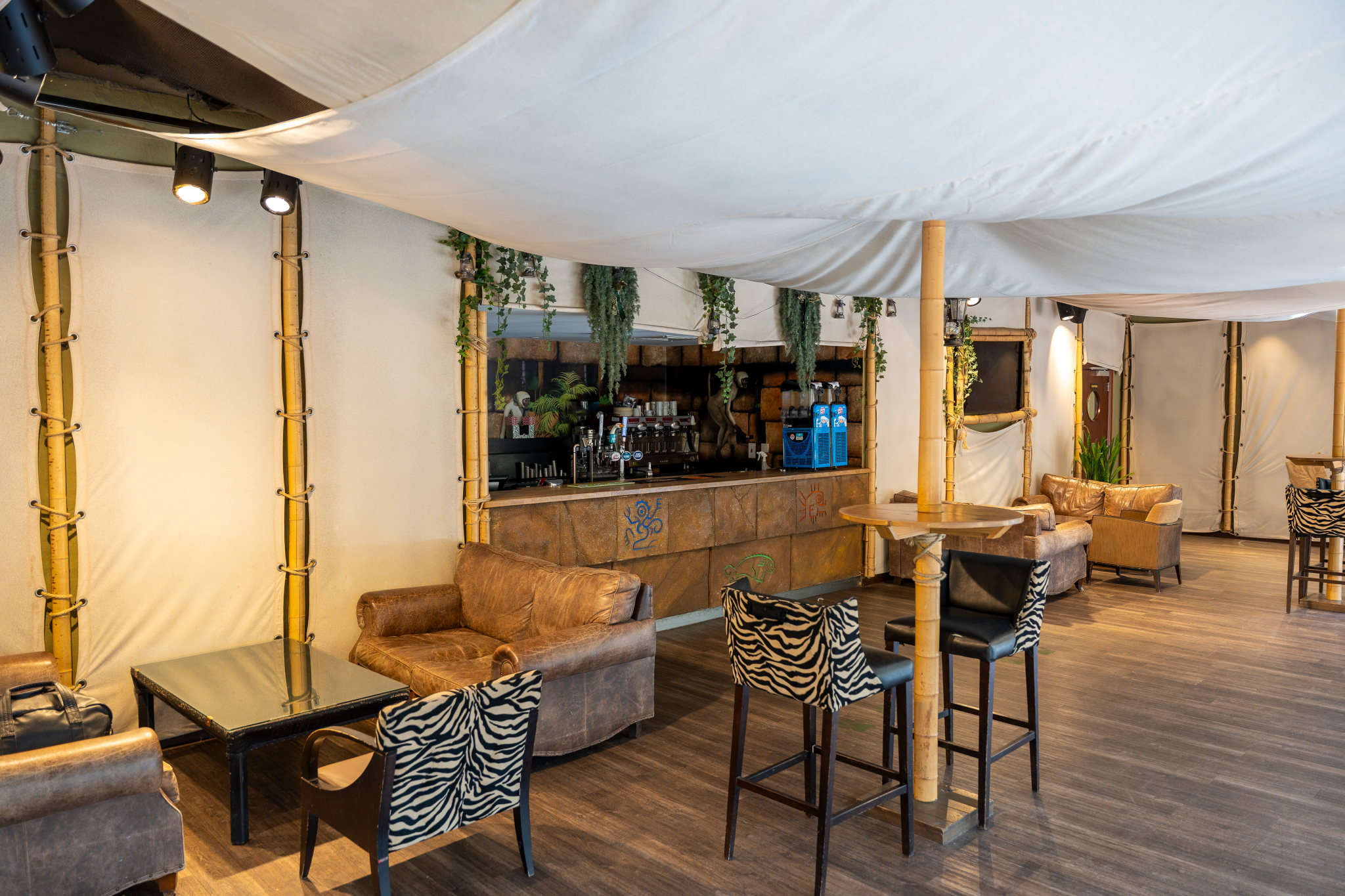Serengeti Suite at Chessington: stylish event space with zebra chairs for gatherings.