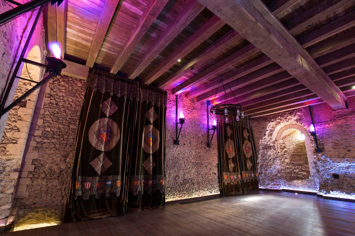 Tapestry Floor at Hedingham Castle: rustic event space with exposed stone walls, ideal for weddings.