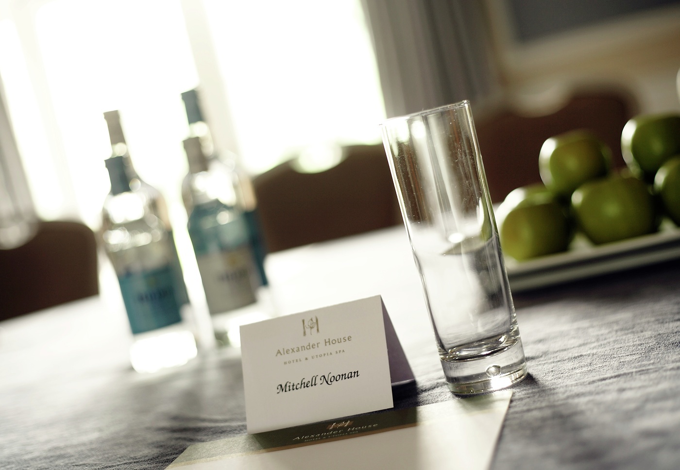 Asquith Suite meeting setup with personalized name card and refreshments at Alexander House Hotel.