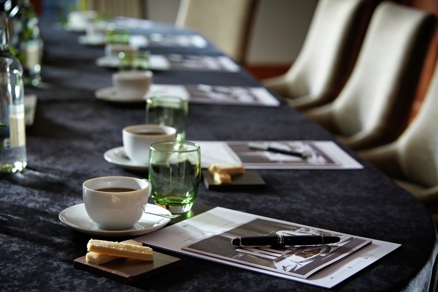 Meeting setup at Langshott Manor Hotel with coffee, snacks, and professional ambiance.