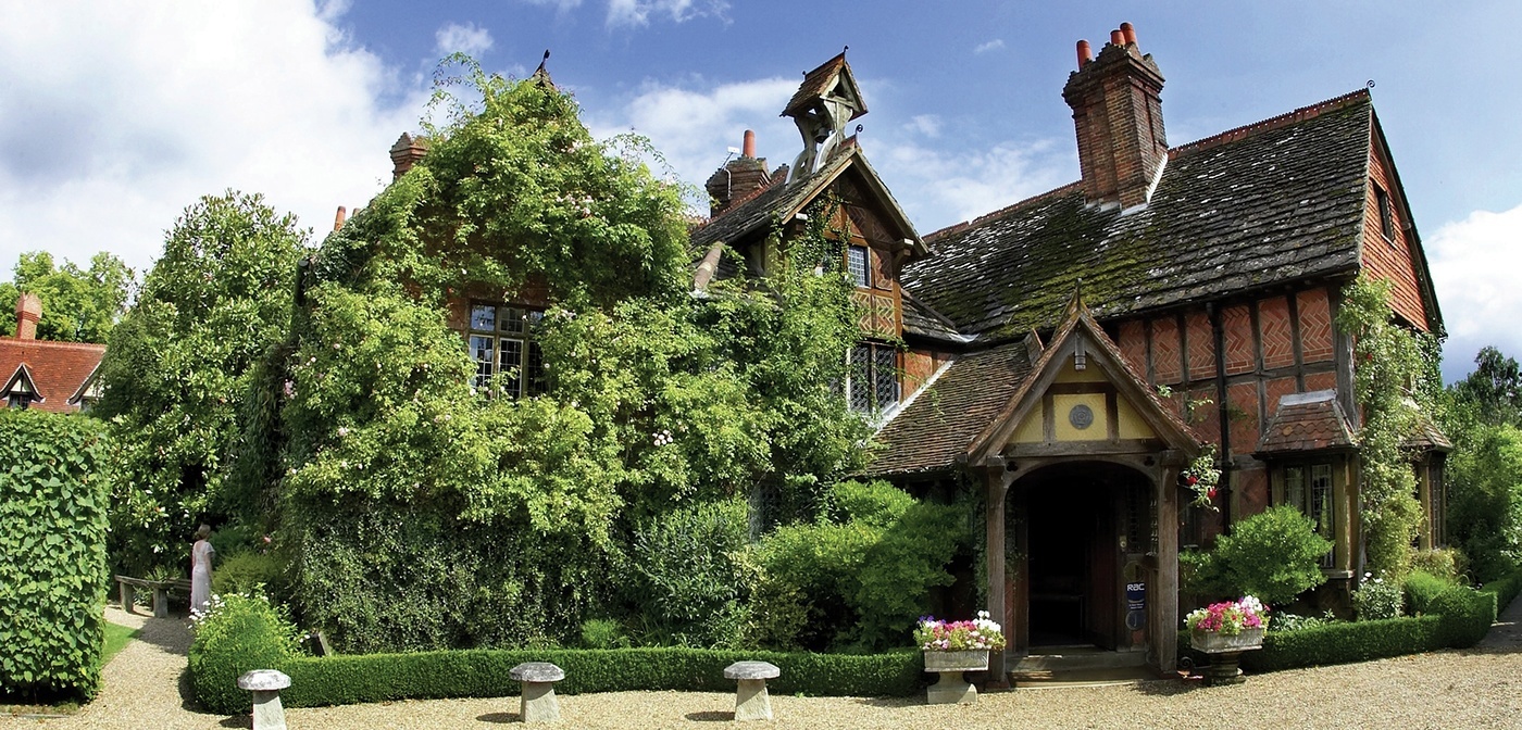 Charming Langshott Manor Hotel venue with lush gardens, ideal for weddings and events.