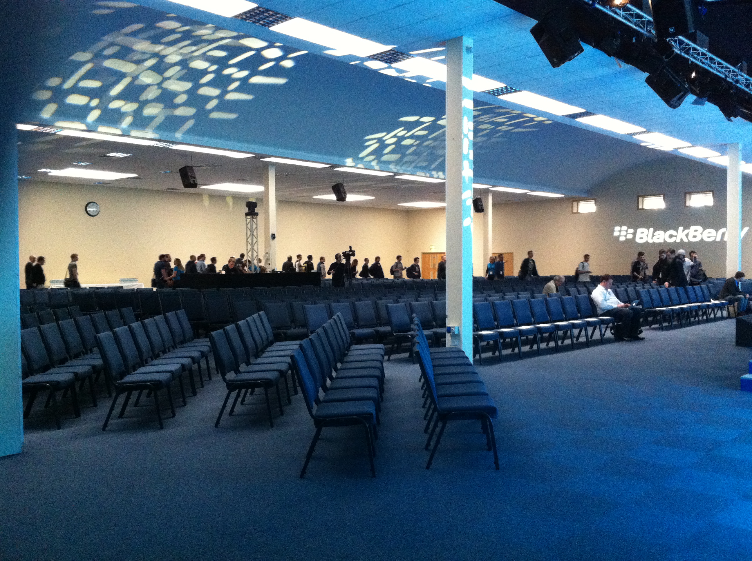 Thames Hall in Oxford set for a corporate presentation with empty chairs and event setup.