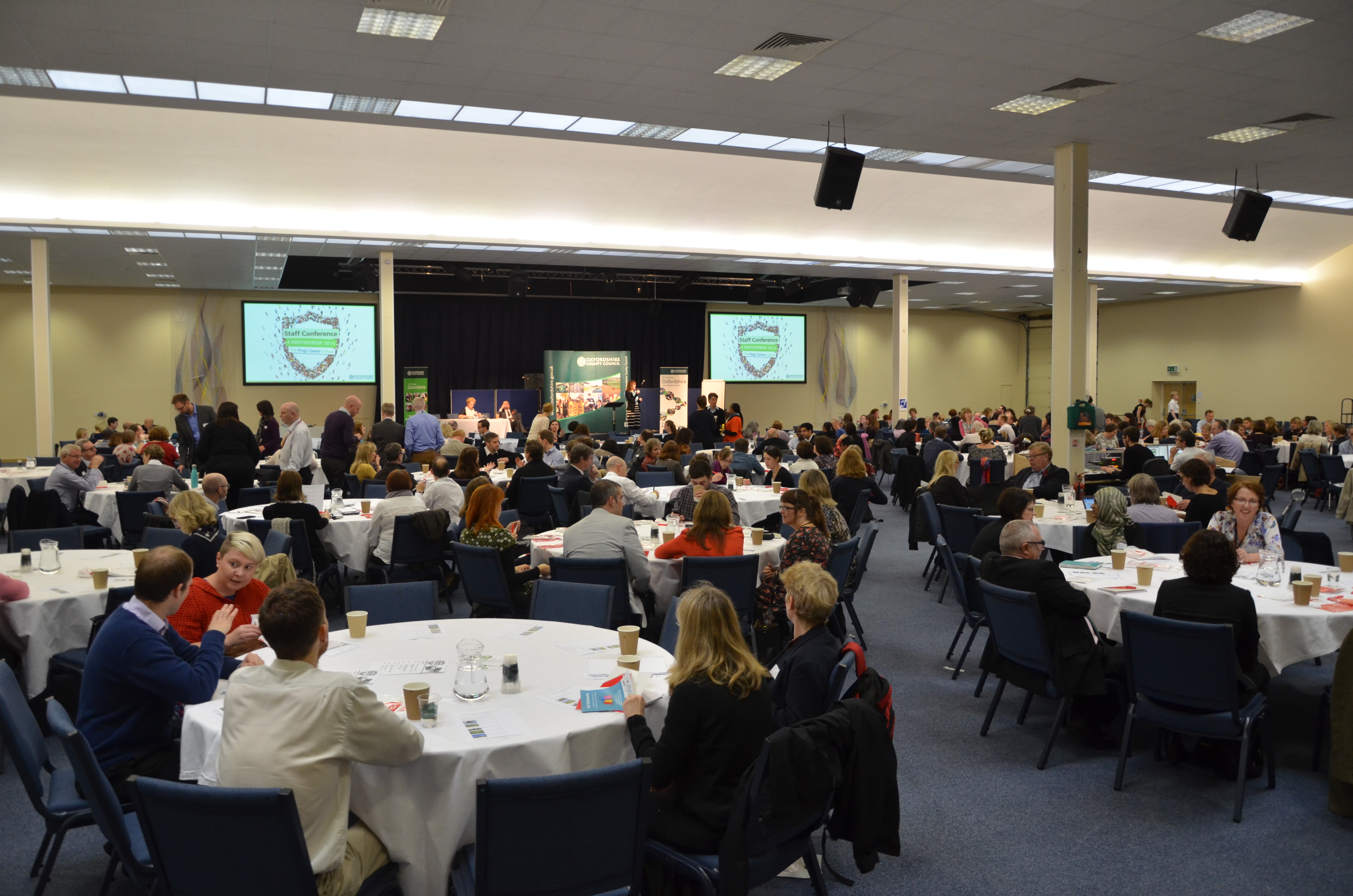 Thames Hall conference venue in Oxford with round tables for networking event.