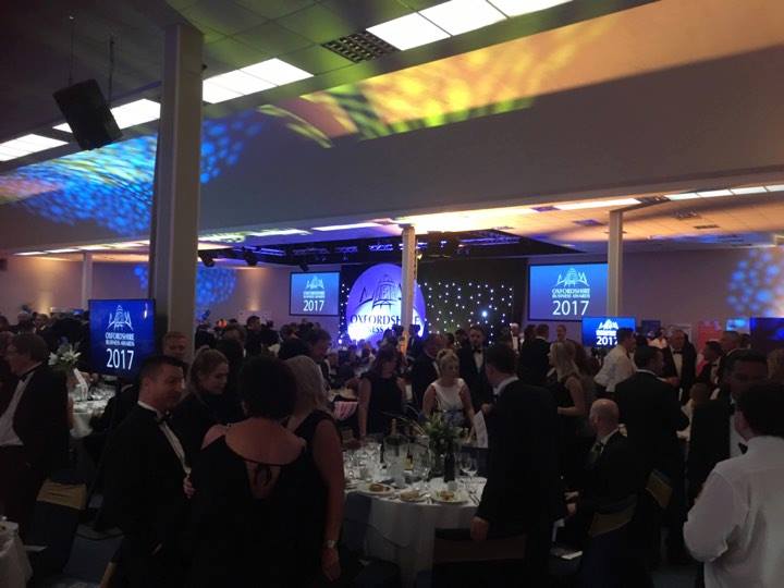 Thames Hall gala event with elegant decor and formal attire attendees in Oxford.