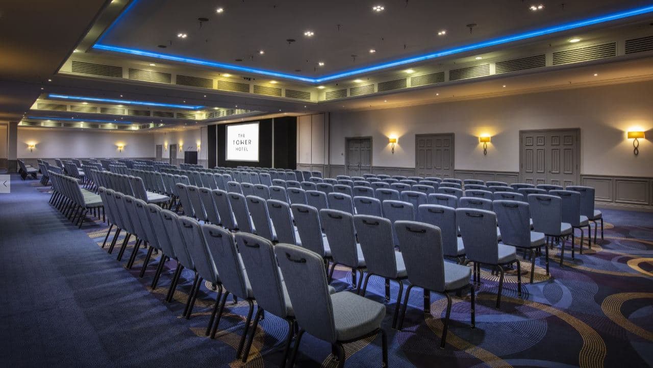 Spacious Tower Suite conference room with chairs for corporate seminars and meetings.