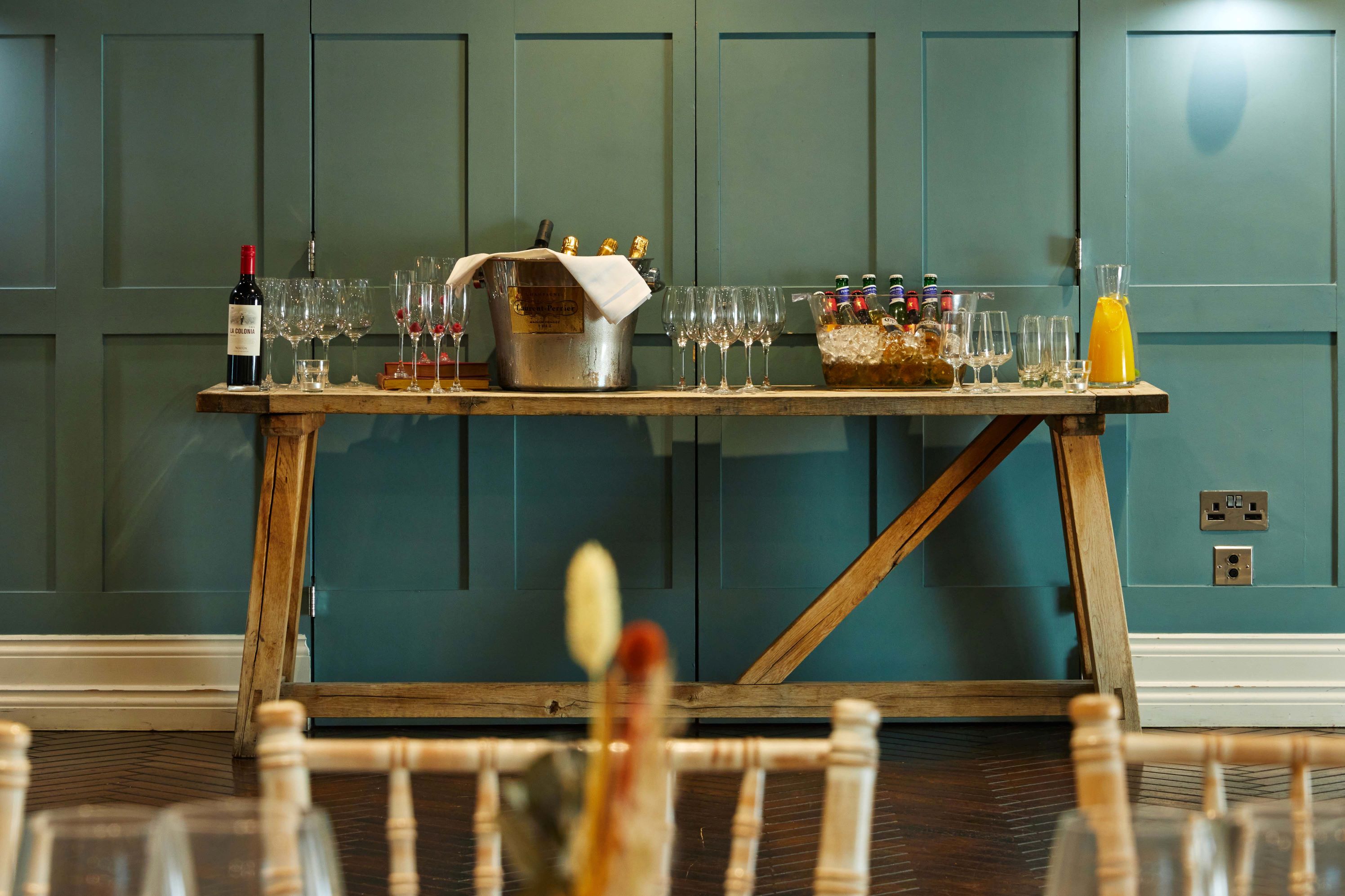 Beverage station at King Street Townhouse, featuring wine and sparkling glasses for events.