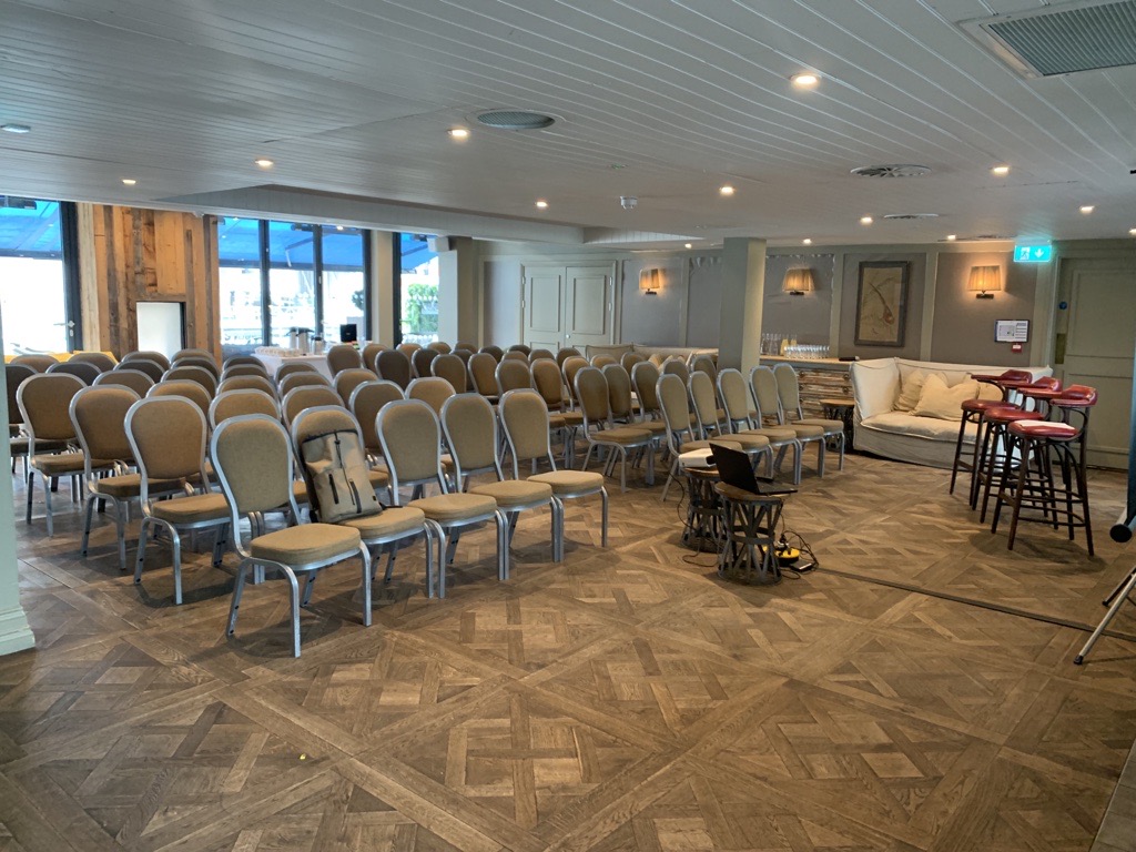 South Terrace meeting space with arranged chairs, ideal for workshops and presentations.