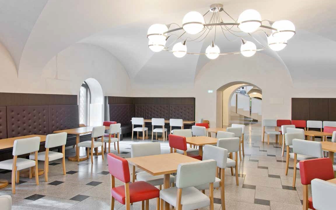 Djanogly Cafe at Tate Britain: modern event space with chandelier, perfect for networking.